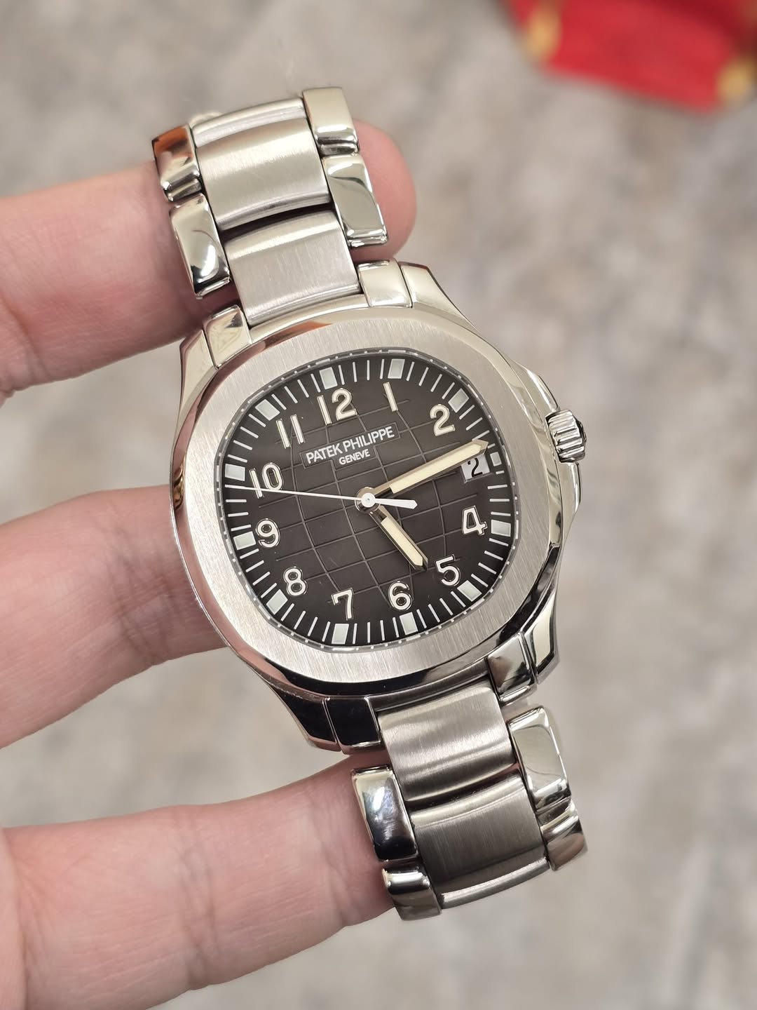 May be an image of wrist watch and text