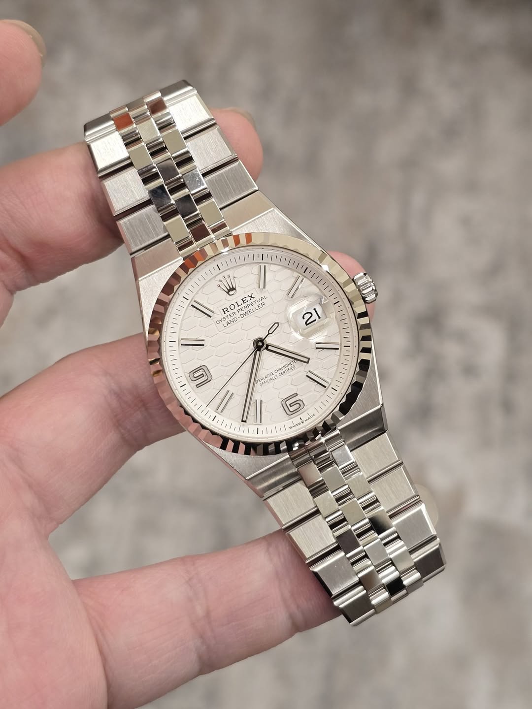 May be an image of wrist watch and text
