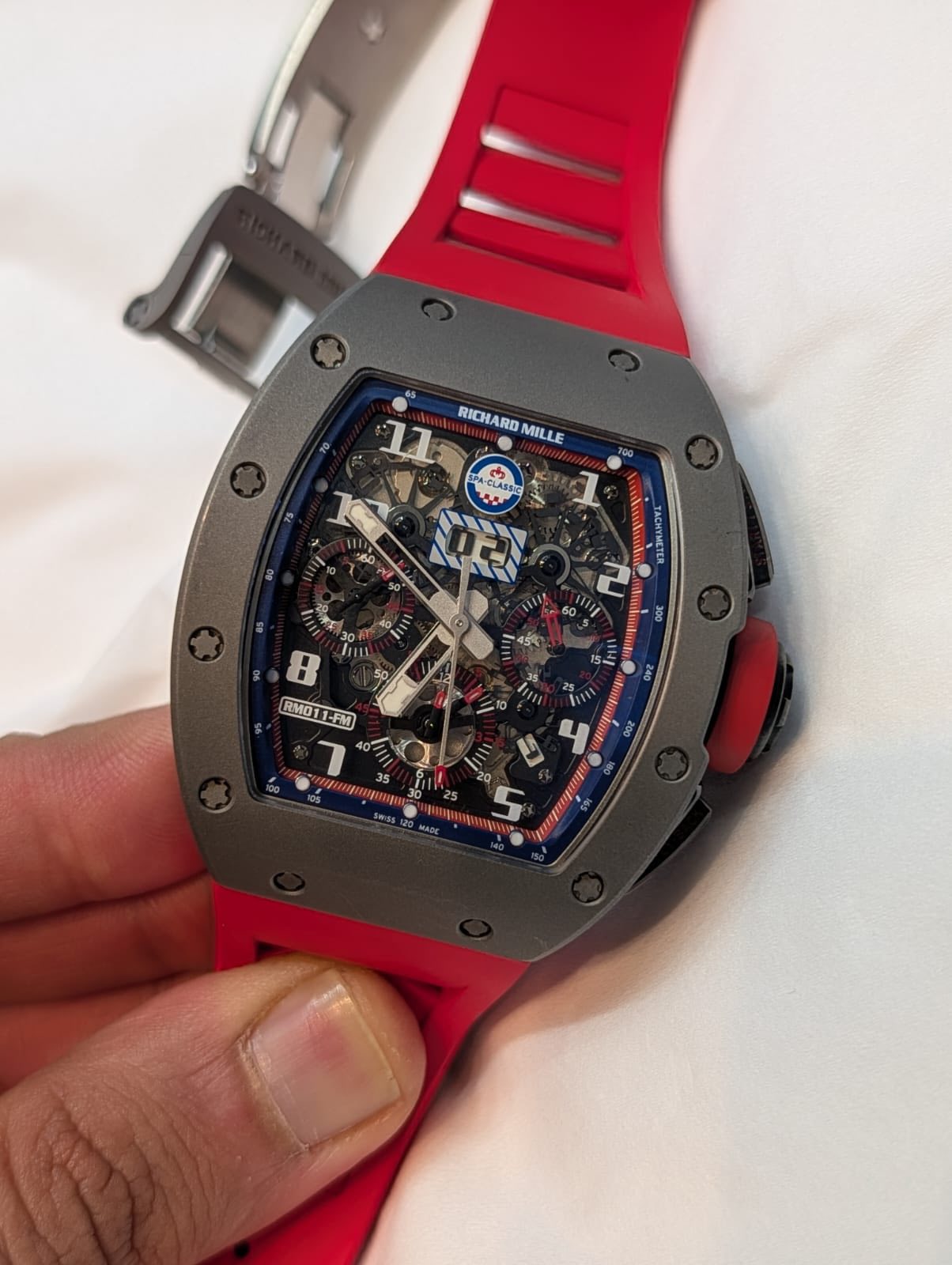 May be an image of wrist watch and text