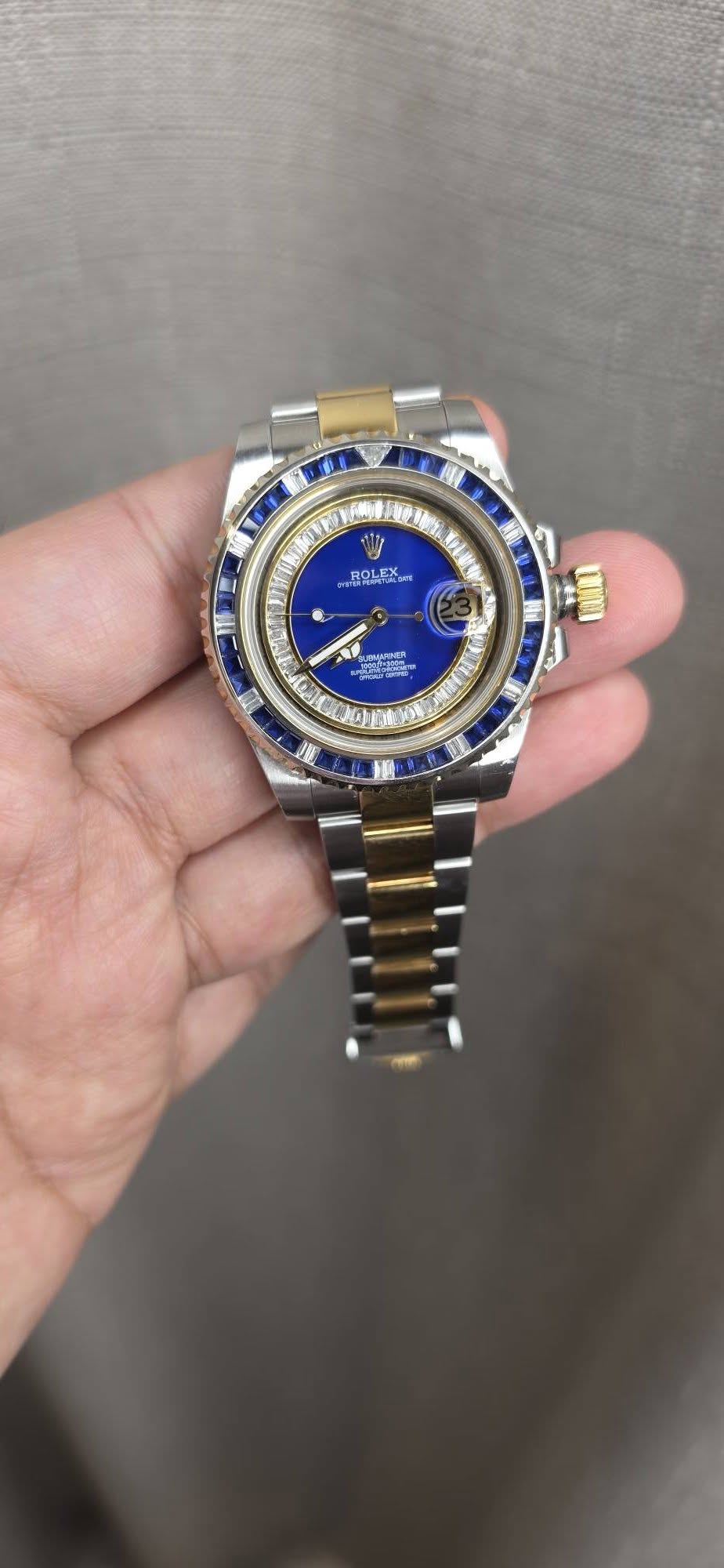May be an image of wrist watch and text