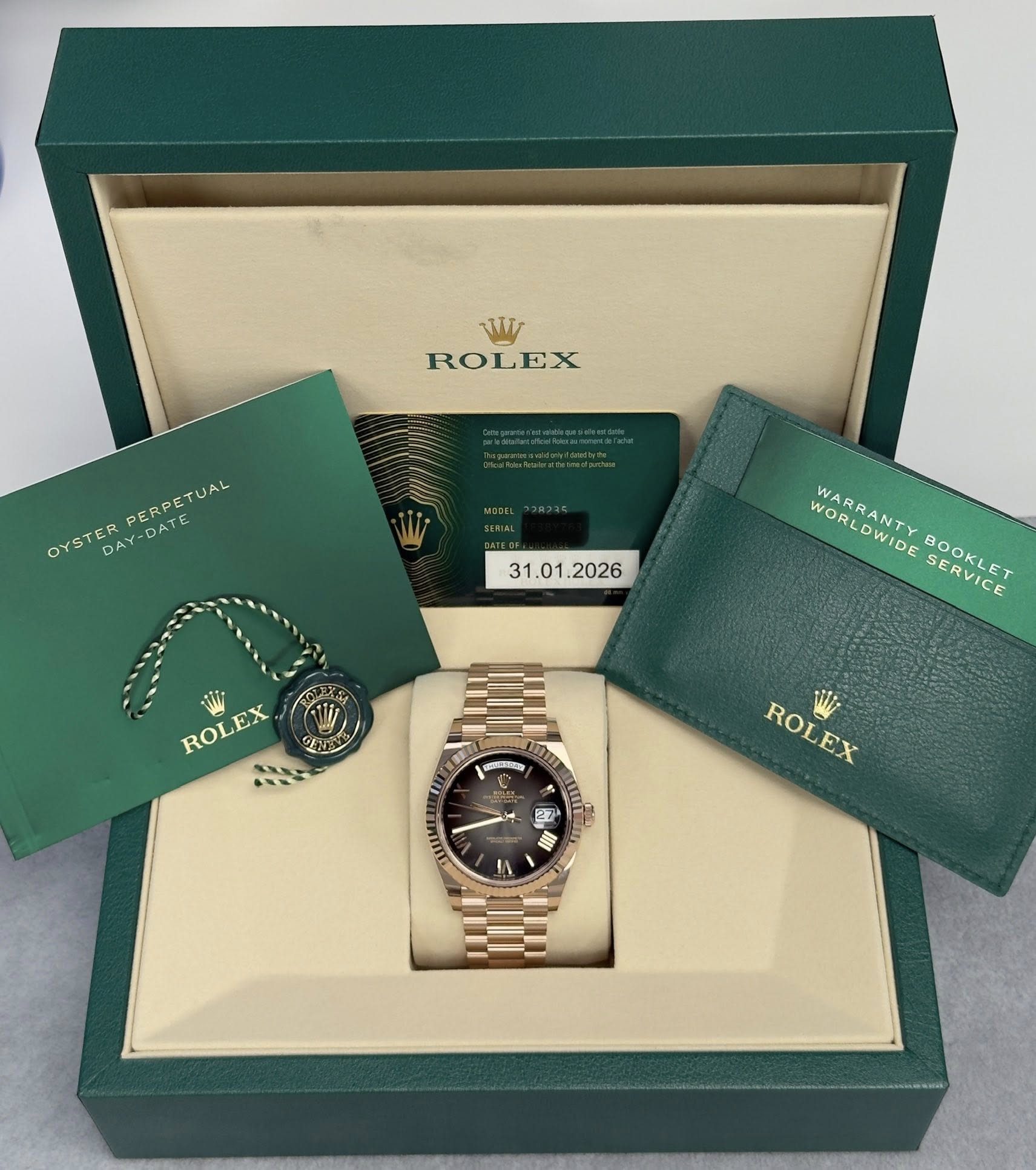 May be an image of wrist watch and text that says 'V ROLEX OYSTER YSTERPEARETUAL PERPETUAL PERPETUAL DAY-DATE DAY-D WORLDWIDE BOOKLET SERVICE WARRANTY ROLEX ROLEX の شدي ROL…