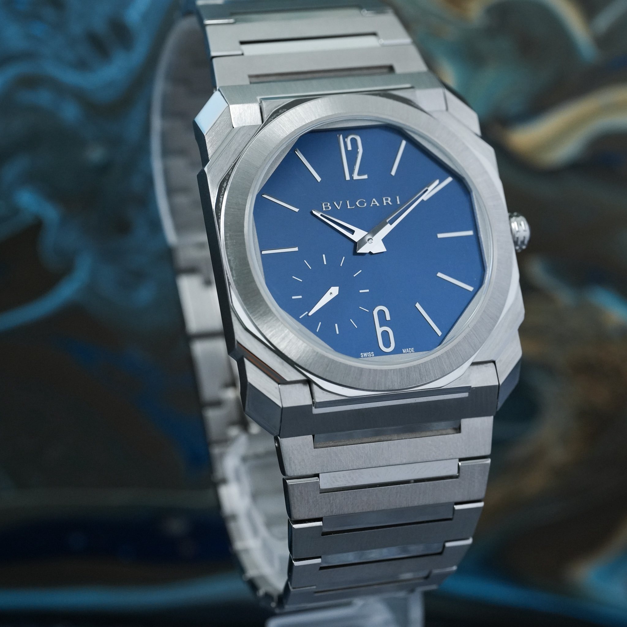 May be an image of wrist watch and text that says '١ 12/ 12 BVLGARI B L ۱ 6 MADE SW在'