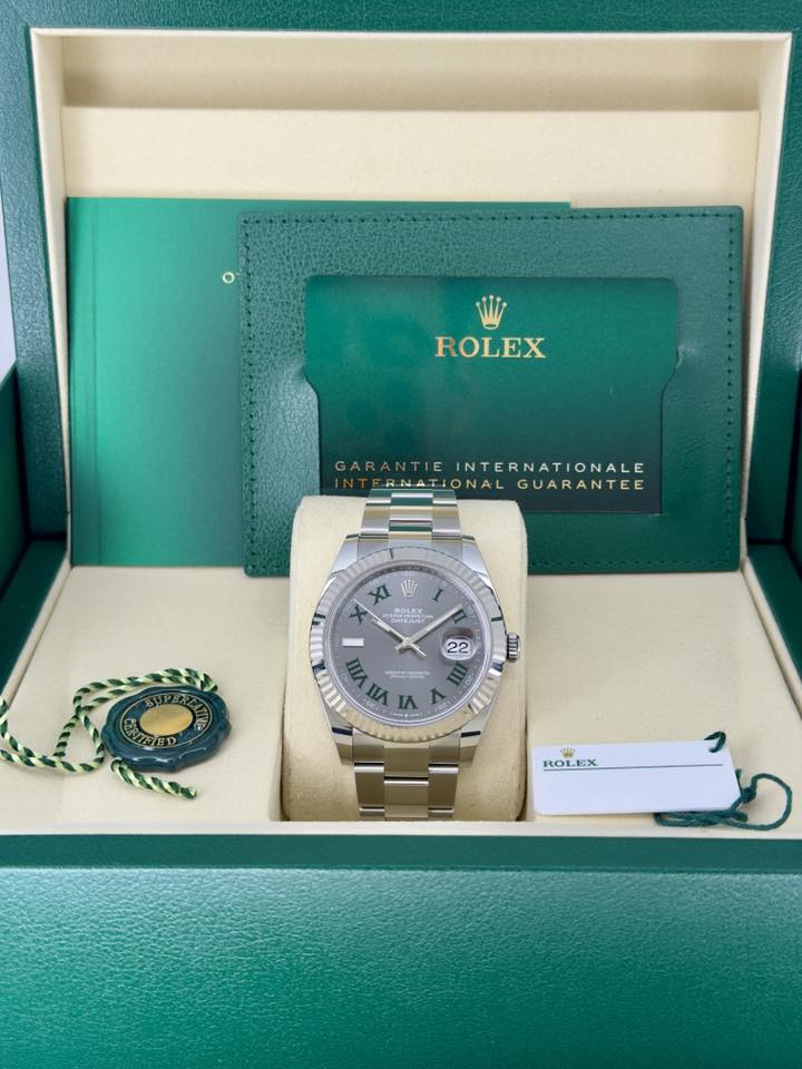 May be an image of wrist watch and text that says 'ROLEX GARANTIE ARANTIEINTERNATIONALE INTERNATIONALE FRNATIONALGUARANTEE NATIONA GUARANTEE XI aaheesle م ي BOLEX မ်ာ်း LEK 22 മ…