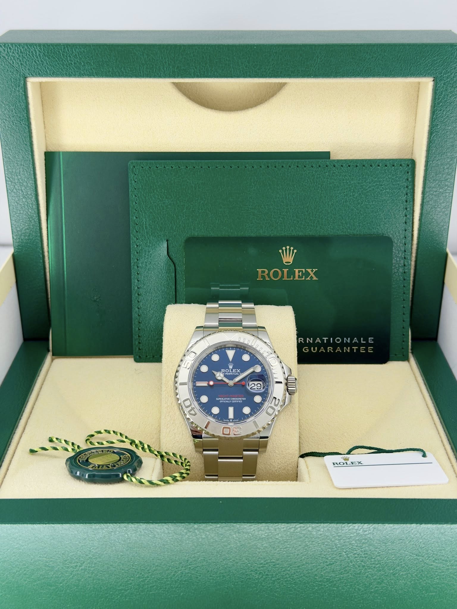 May be an image of wrist watch and text that says 'ROLEX ROLEX S NATIONALE " 29 GI 20 40 O OLE'