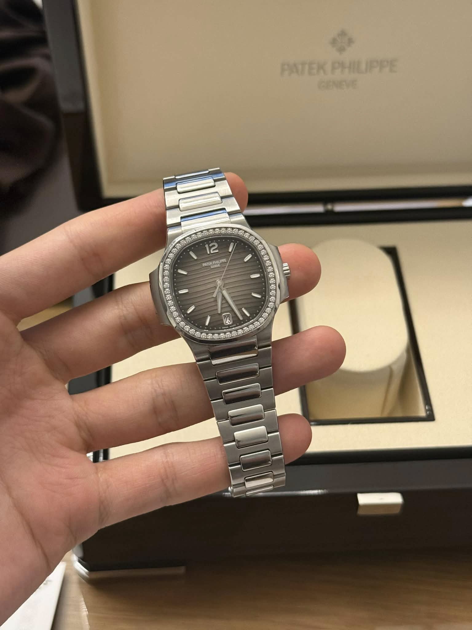 May be an image of wrist watch and text
