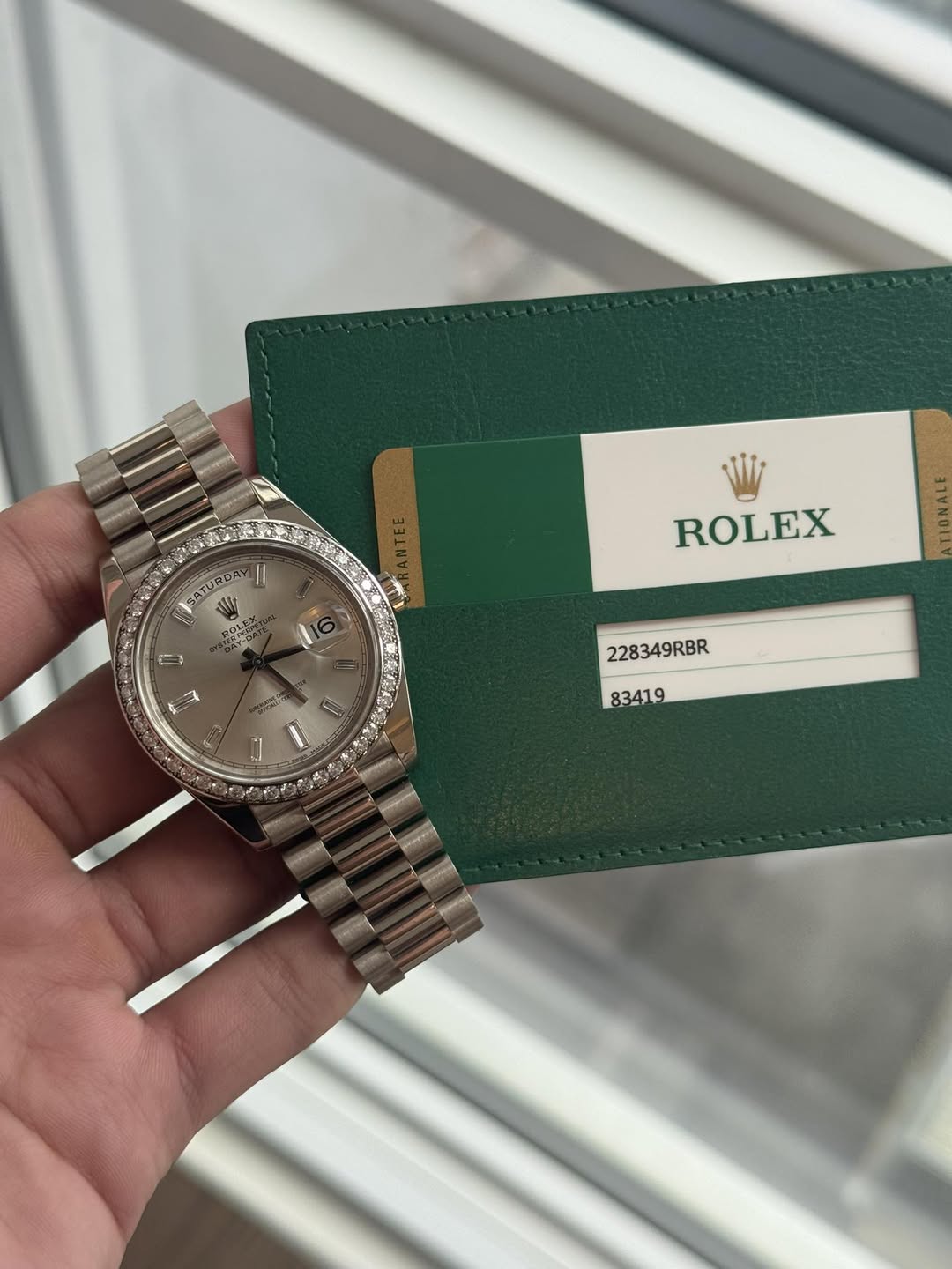 May be an image of wrist watch and text