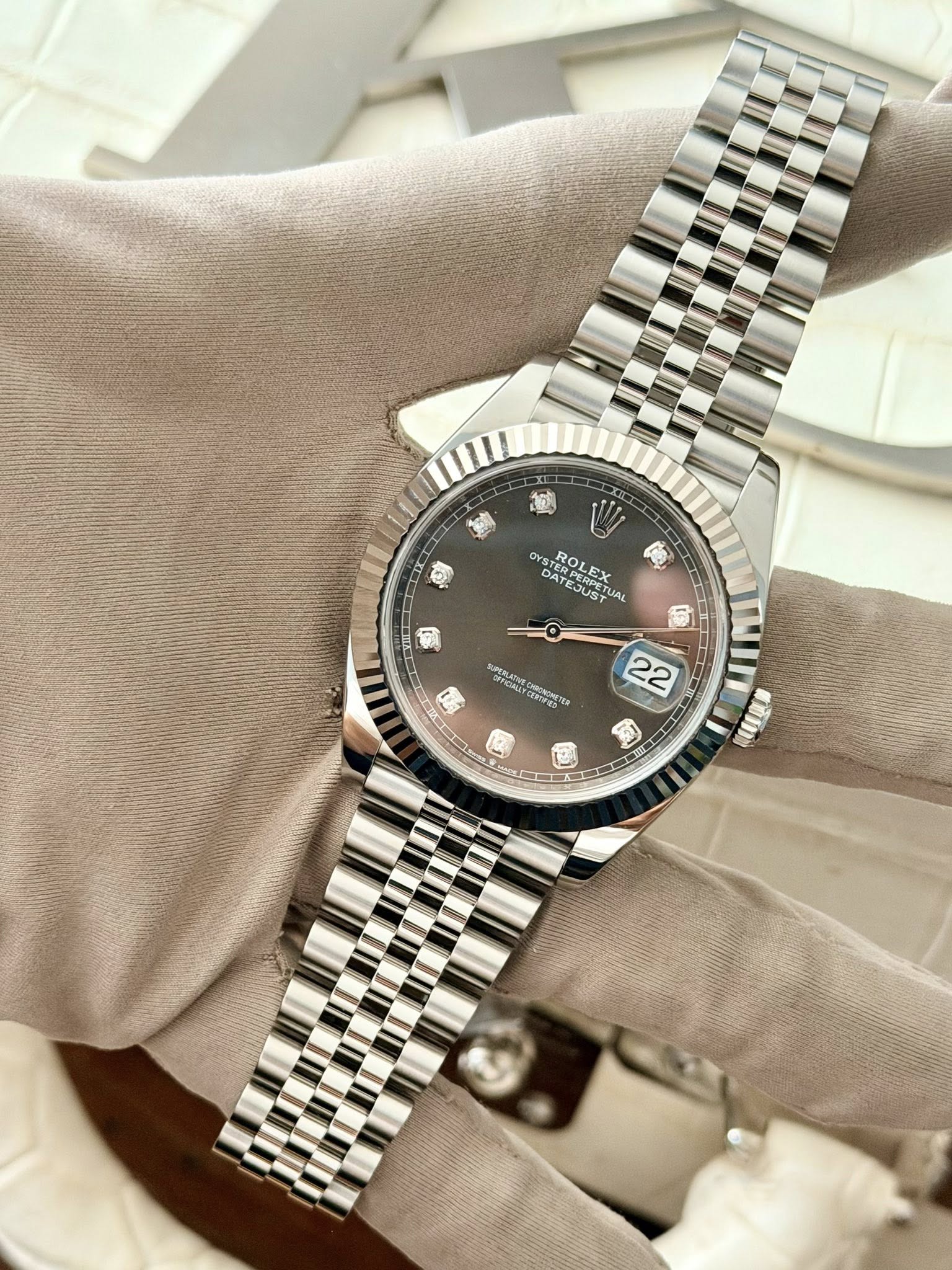 May be an image of wrist watch and text