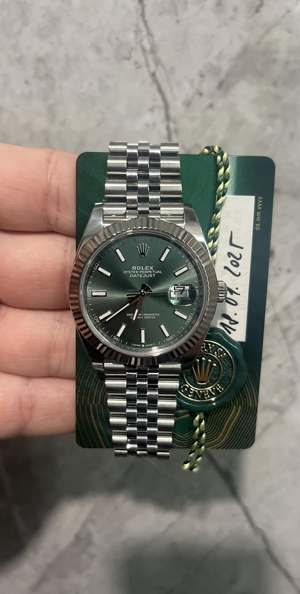 May be an image of wrist watch and text