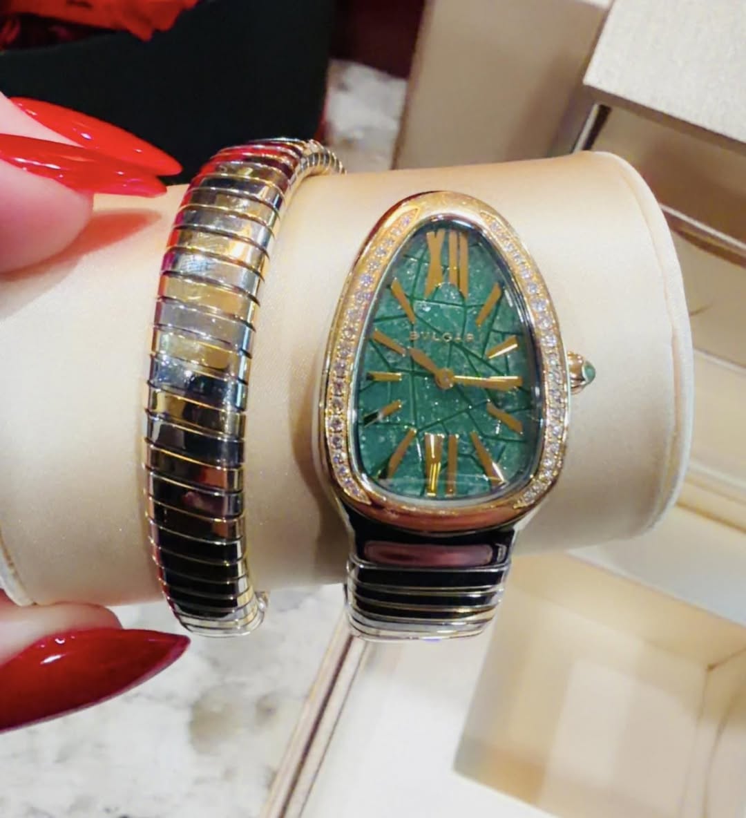 May be an image of wrist watch and jewelry