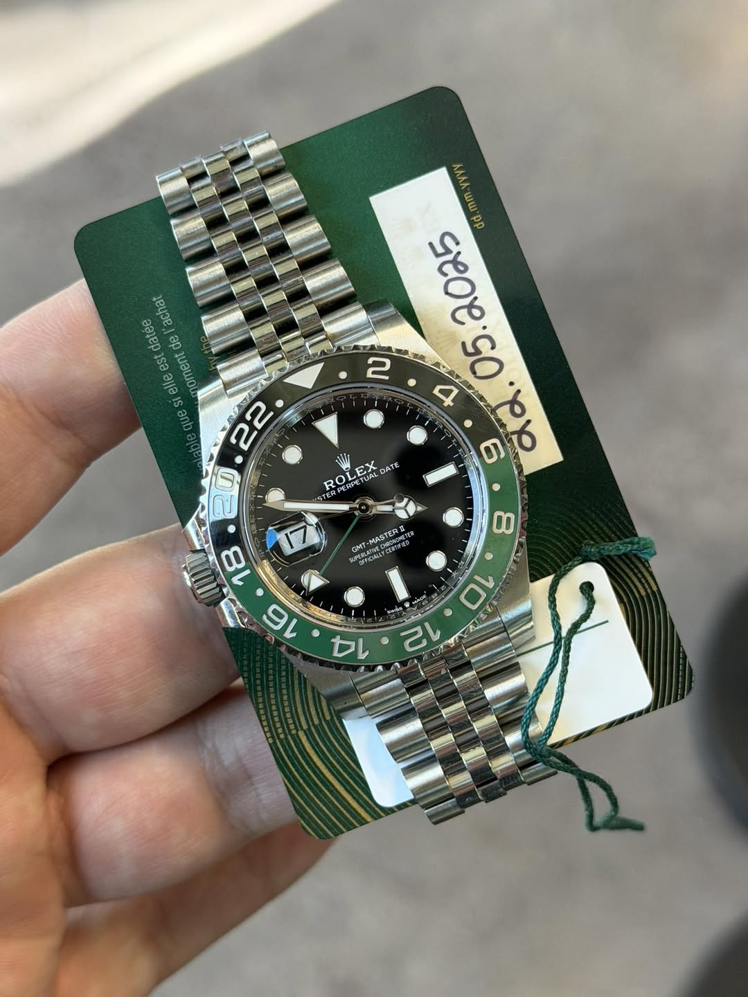 May be an image of wrist watch and text