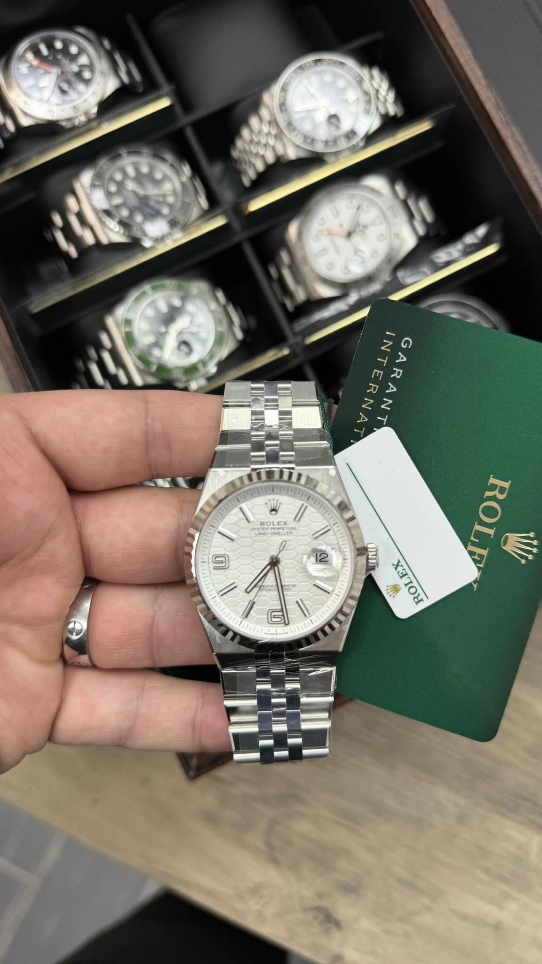 May be an image of wrist watch and text
