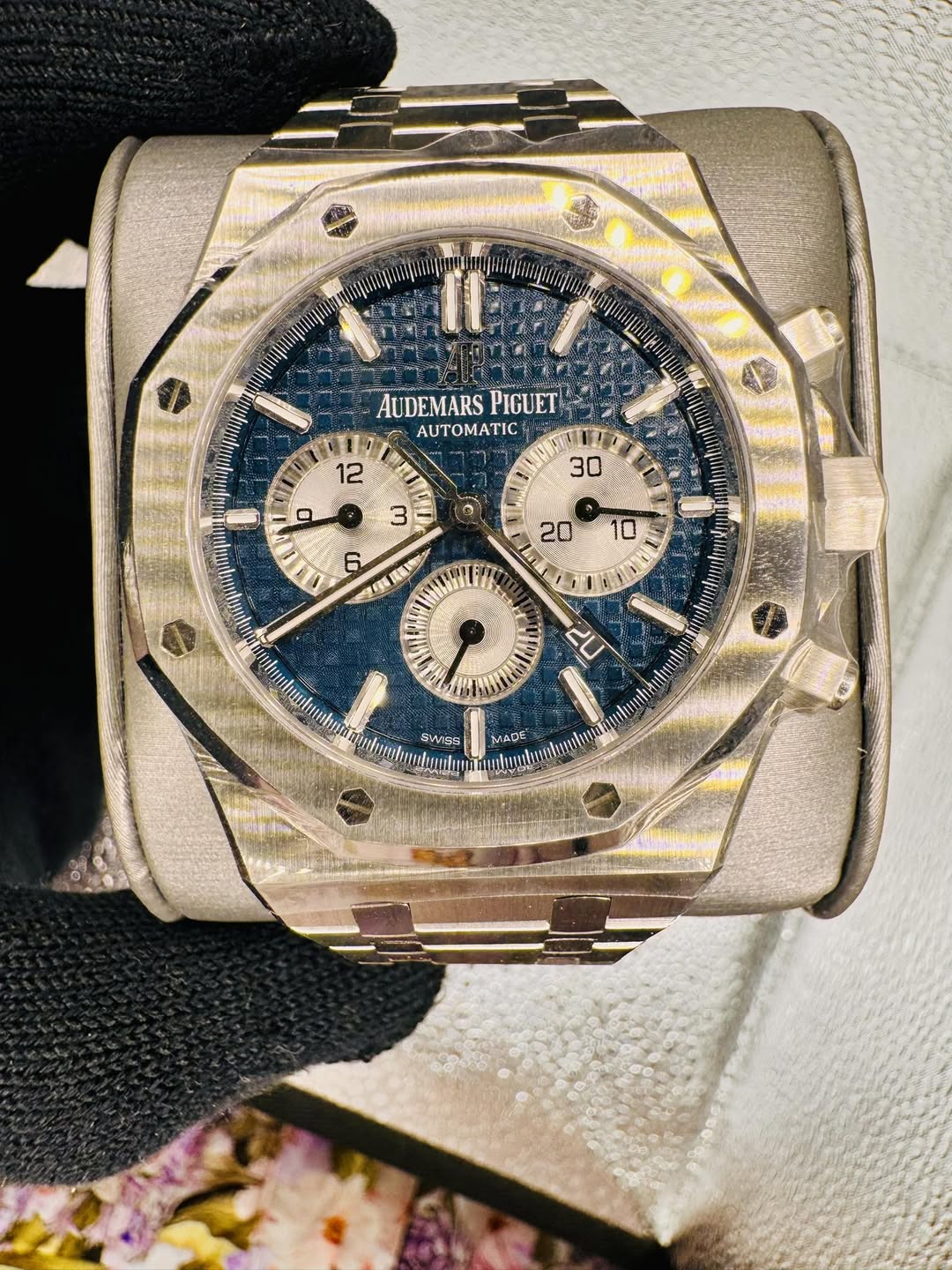 May be an image of wrist watch and text