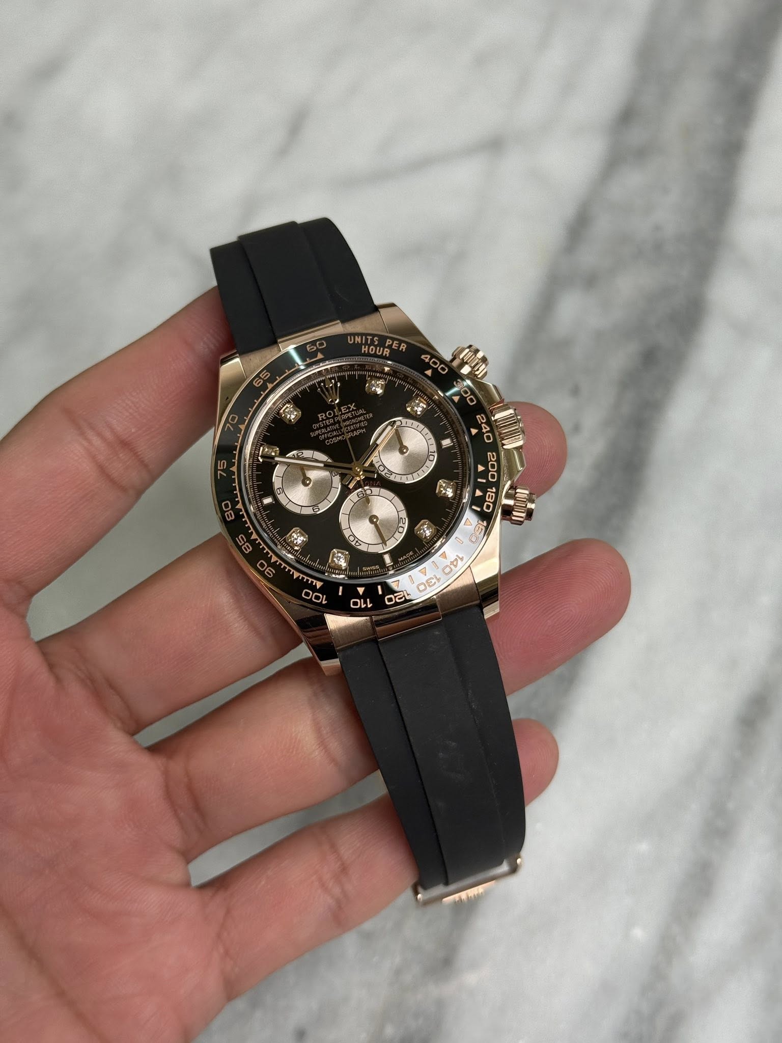 May be an image of wrist watch and text
