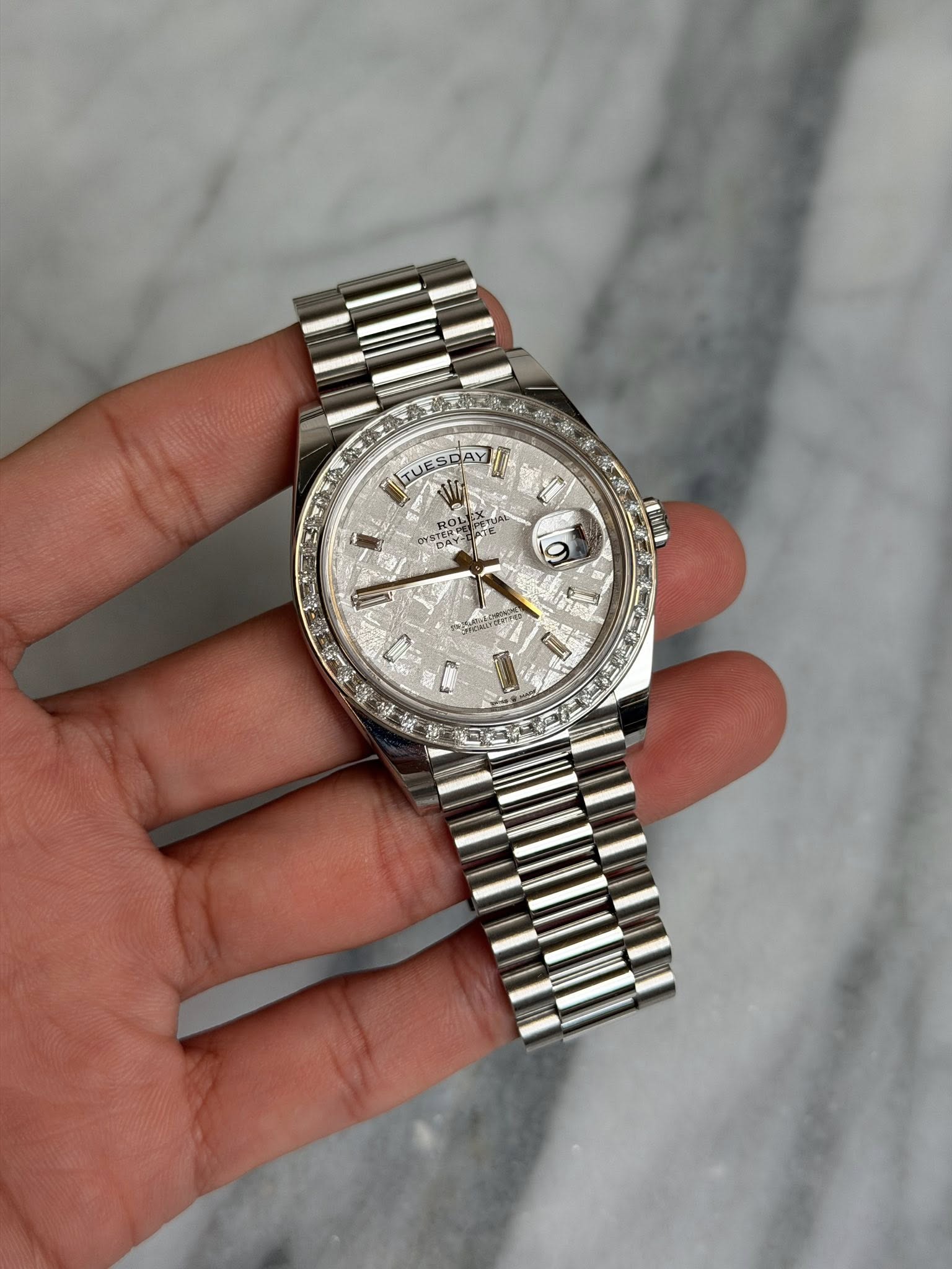 May be an image of wrist watch and text