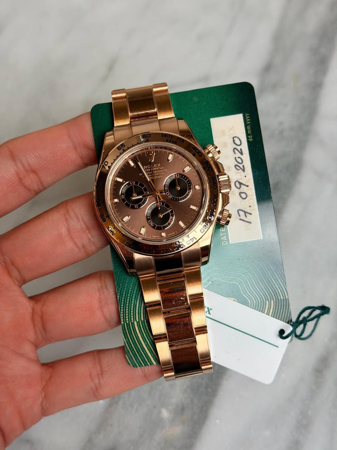 May be an image of wrist watch and text