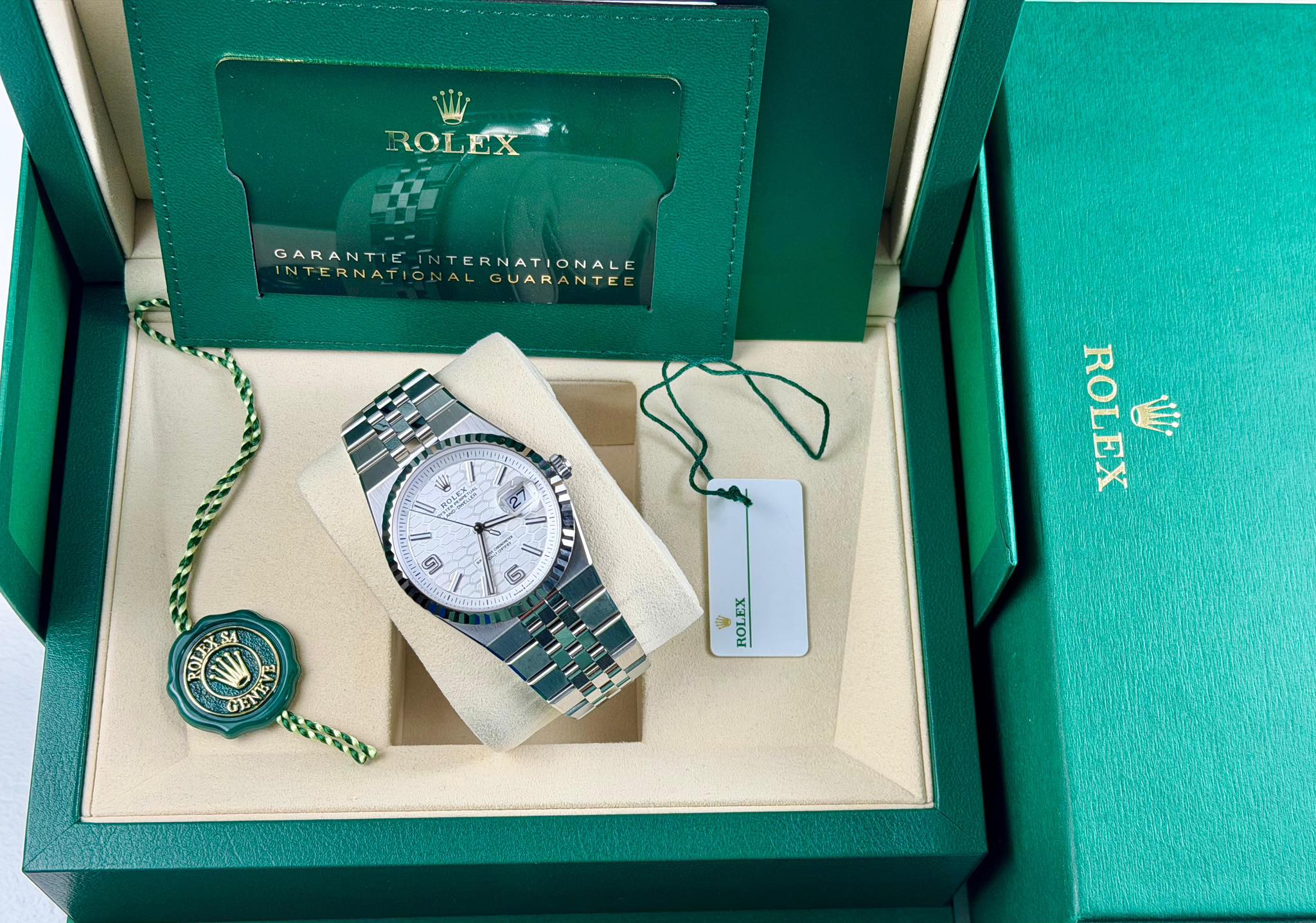 May be an image of wrist watch and text