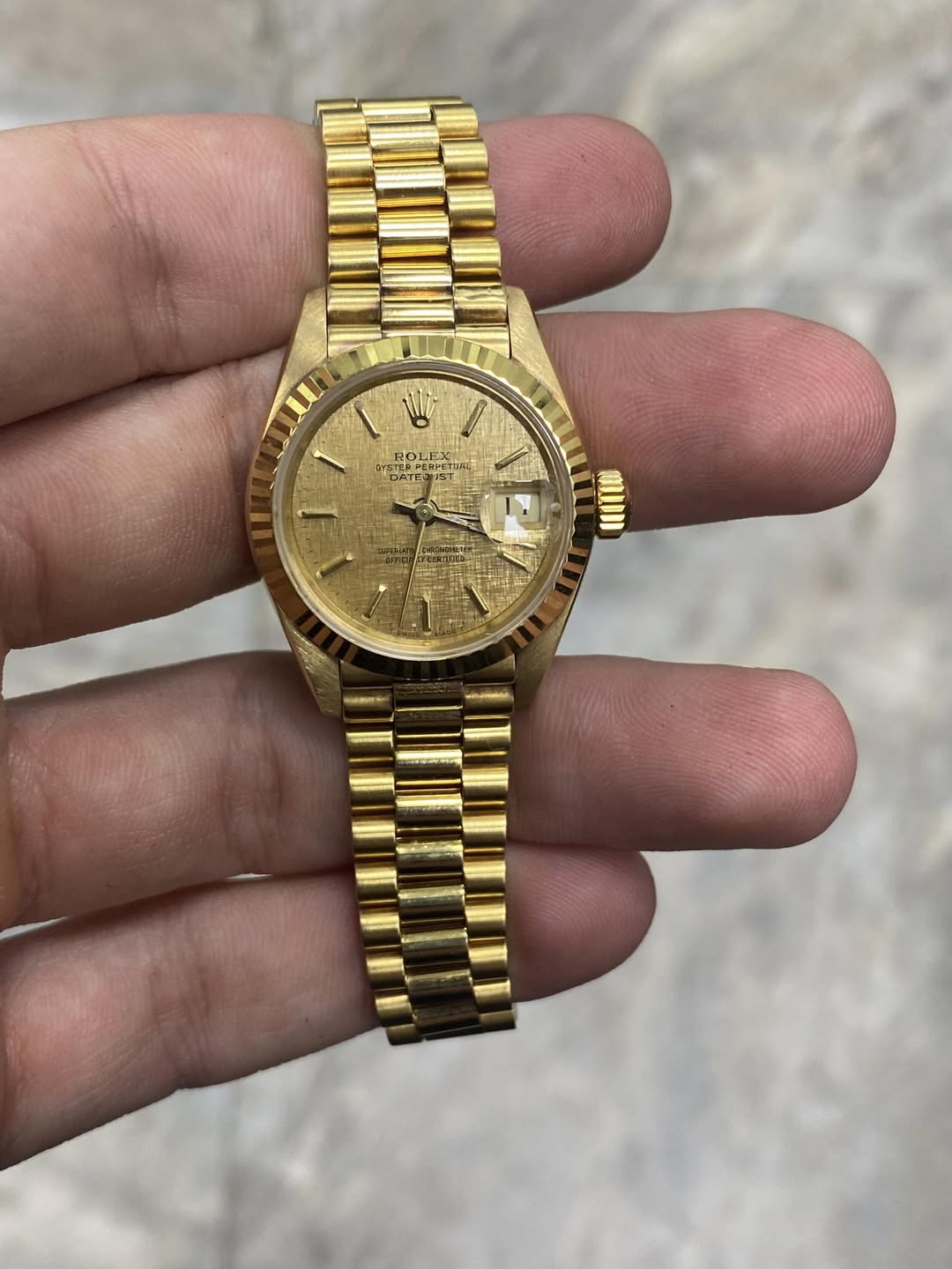 May be an image of wrist watch and text