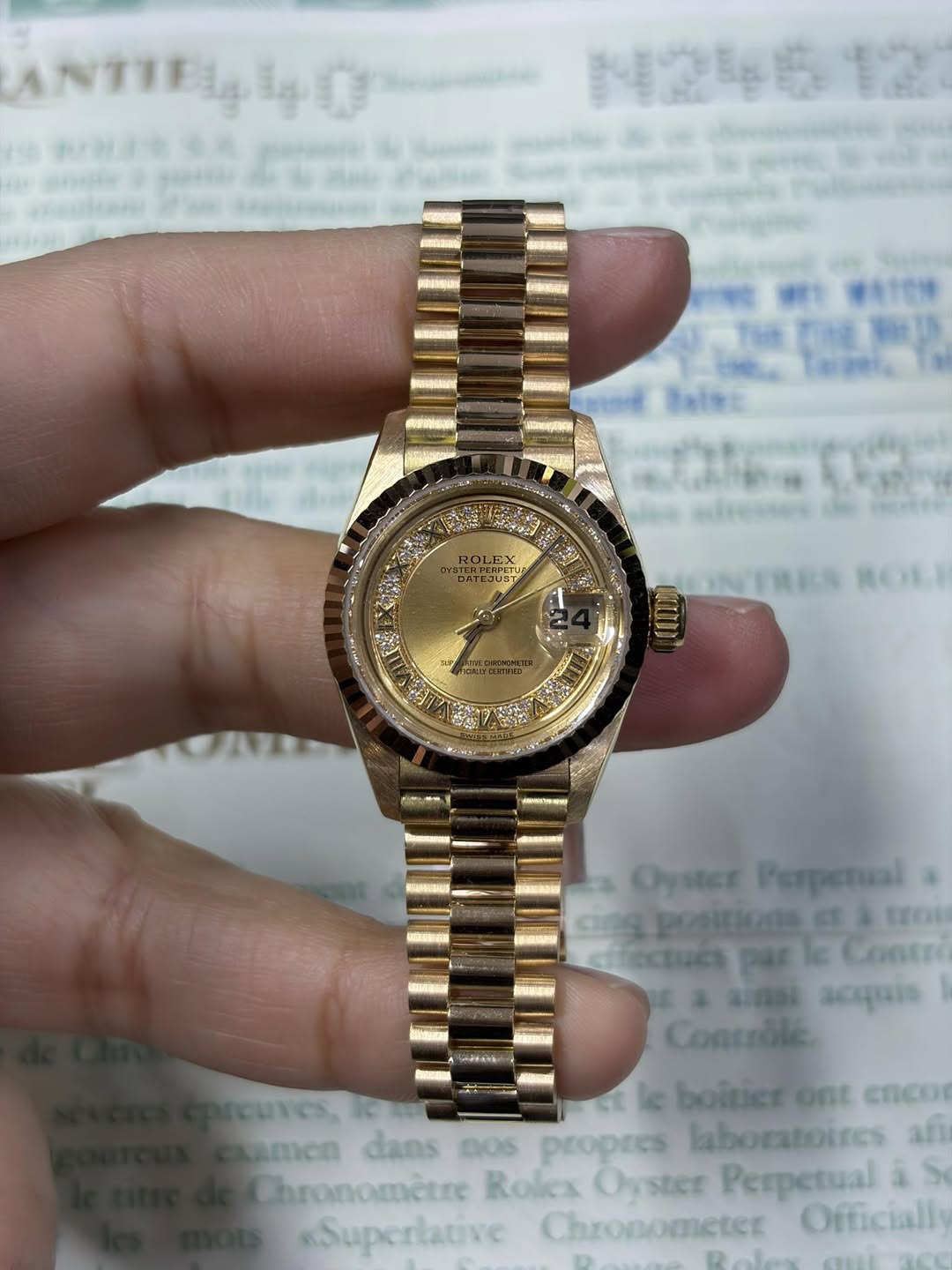 May be an image of wrist watch and text