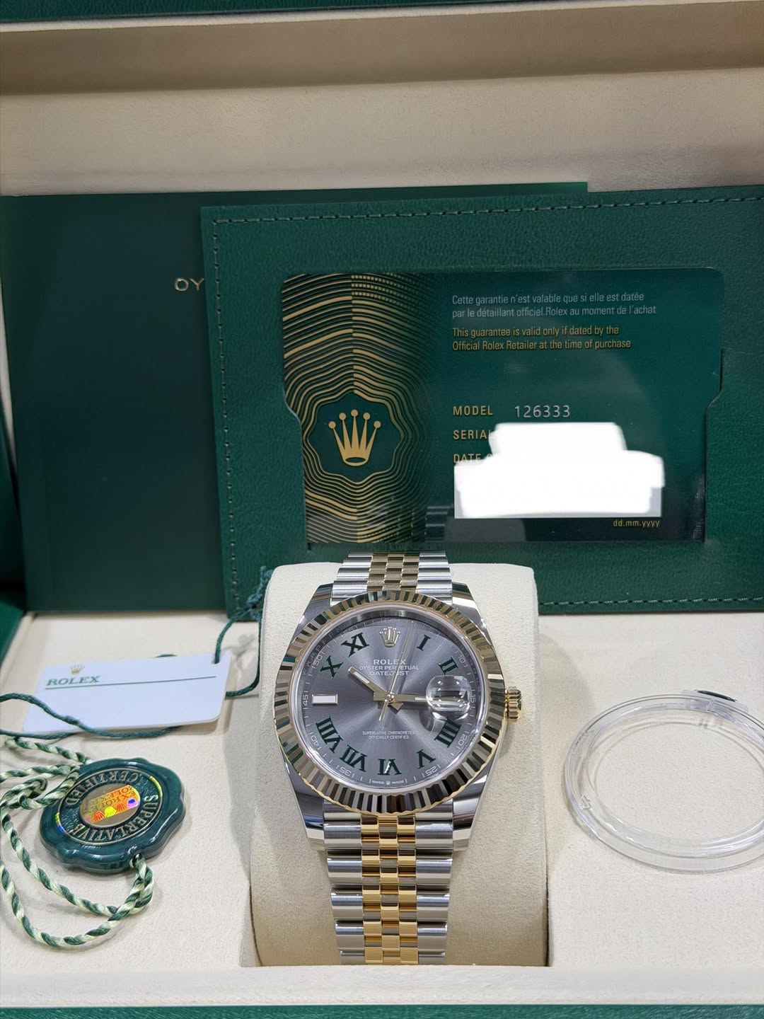 May be an image of wrist watch and text