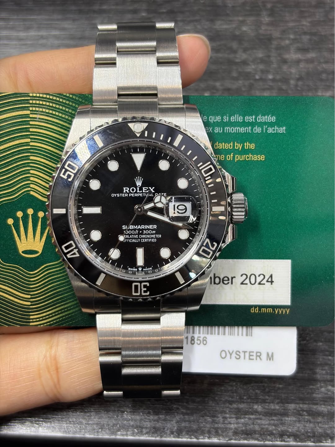 May be an image of wrist watch and text that says 'que si elle est datée x au moment de achat 50 dated by the 10 ባይ e 0 of purchase Nir ROLEX ROI EX OYSTE OYSTERPERPETU PERPETU…