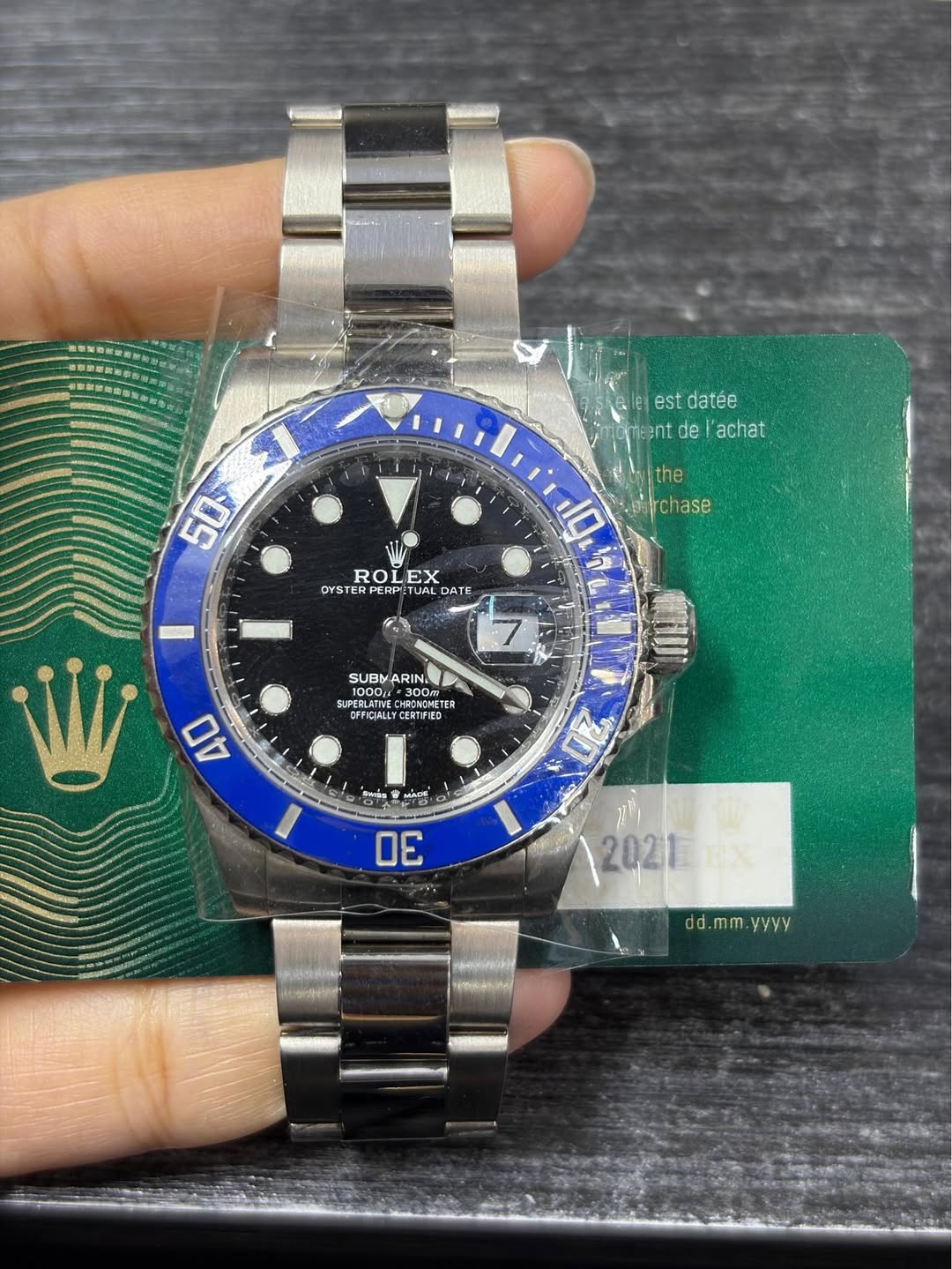 May be an image of wrist watch and text that says 'estdatée est datée meent de achat 50 the 10 parchase chase ROLEX EX OYST YSTERPERPETUALD ROLEX ROI DATE 7 SUBY ARINE 300Vm 300m…