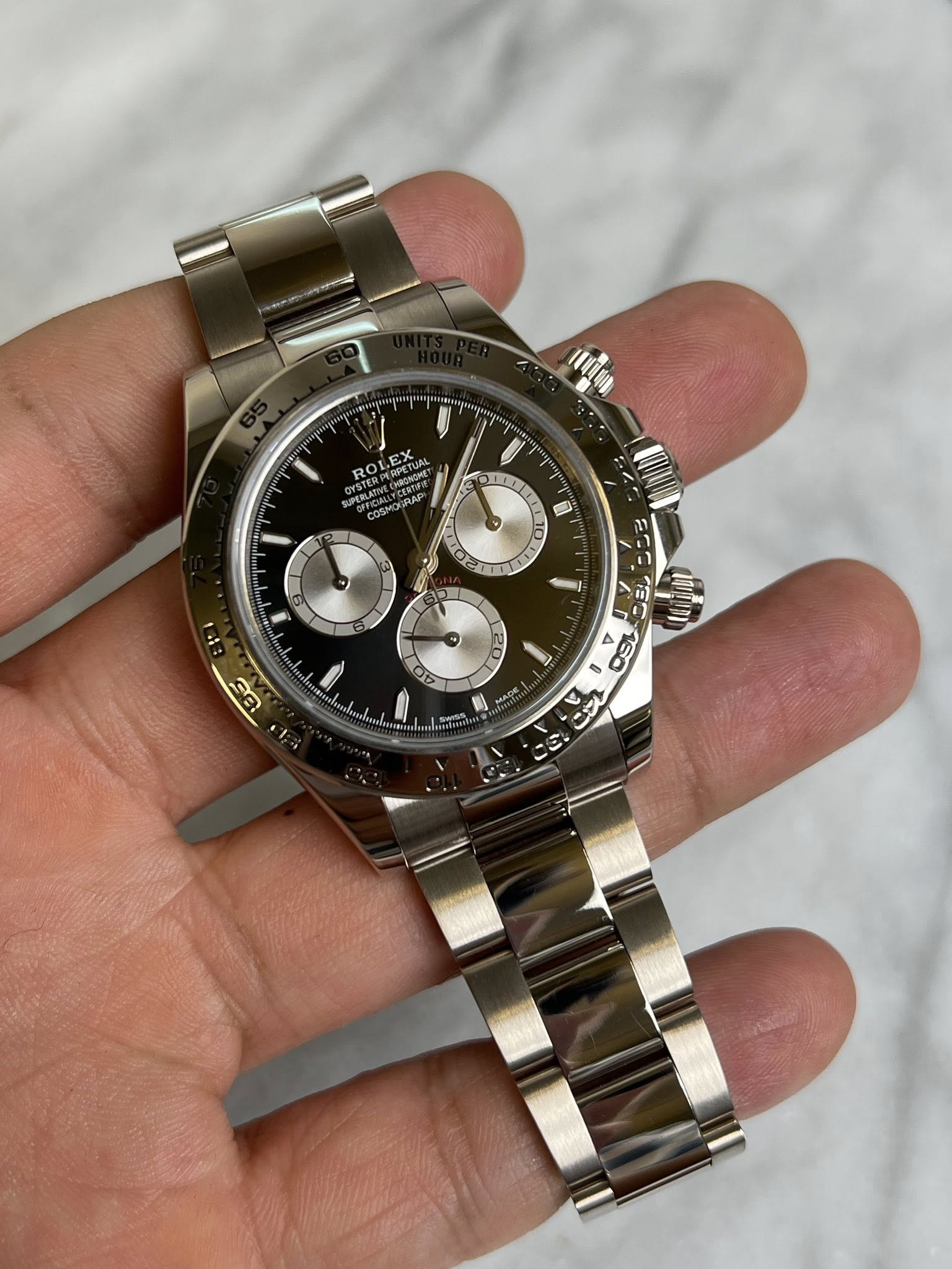 May be an image of wrist watch and text