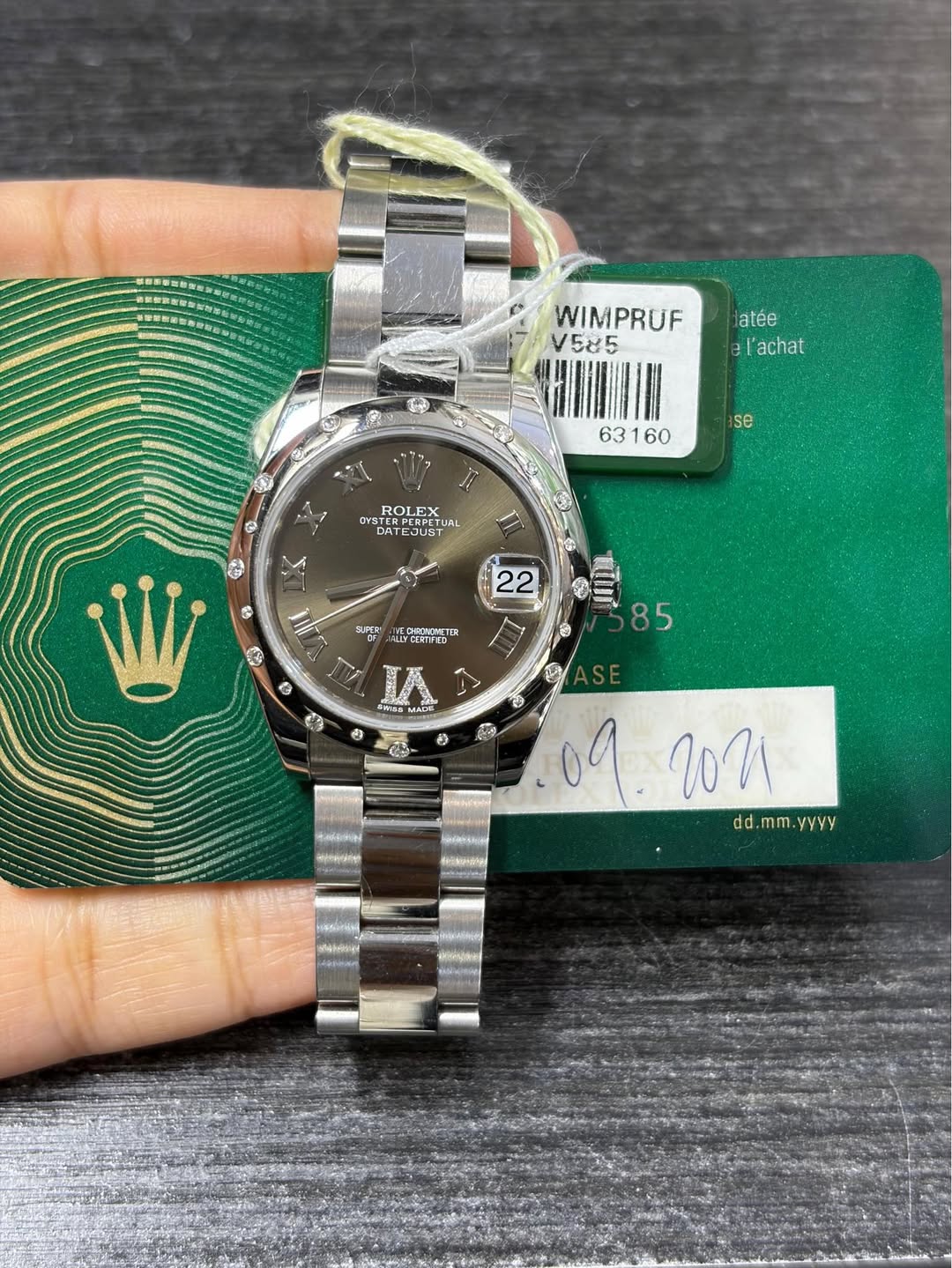 May be an image of wrist watch and text that says 'atée el l'achat WIMPRUF V585 HININ se ROLEX OYSTER VST ERPEBEST AET 5 DA TEDUST পল JAL 6 85 6 9 さE ECHINETT V คนย ఆ e C9- 22…