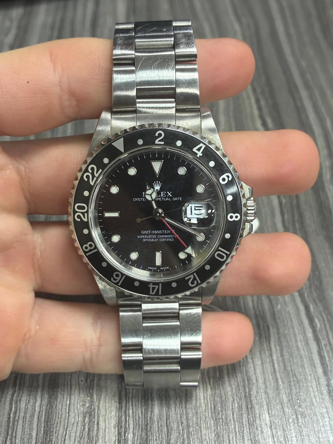 May be an image of wrist watch and text