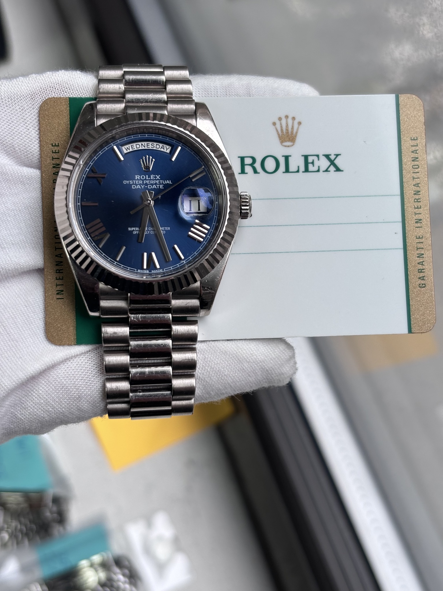 May be an image of wrist watch and text that says 'WEDNESDAY ROLES LEX OYS DA STERE TERP DAY DATE ATE 7 SUPEBL FO ROLEX cmm III = ANRA'