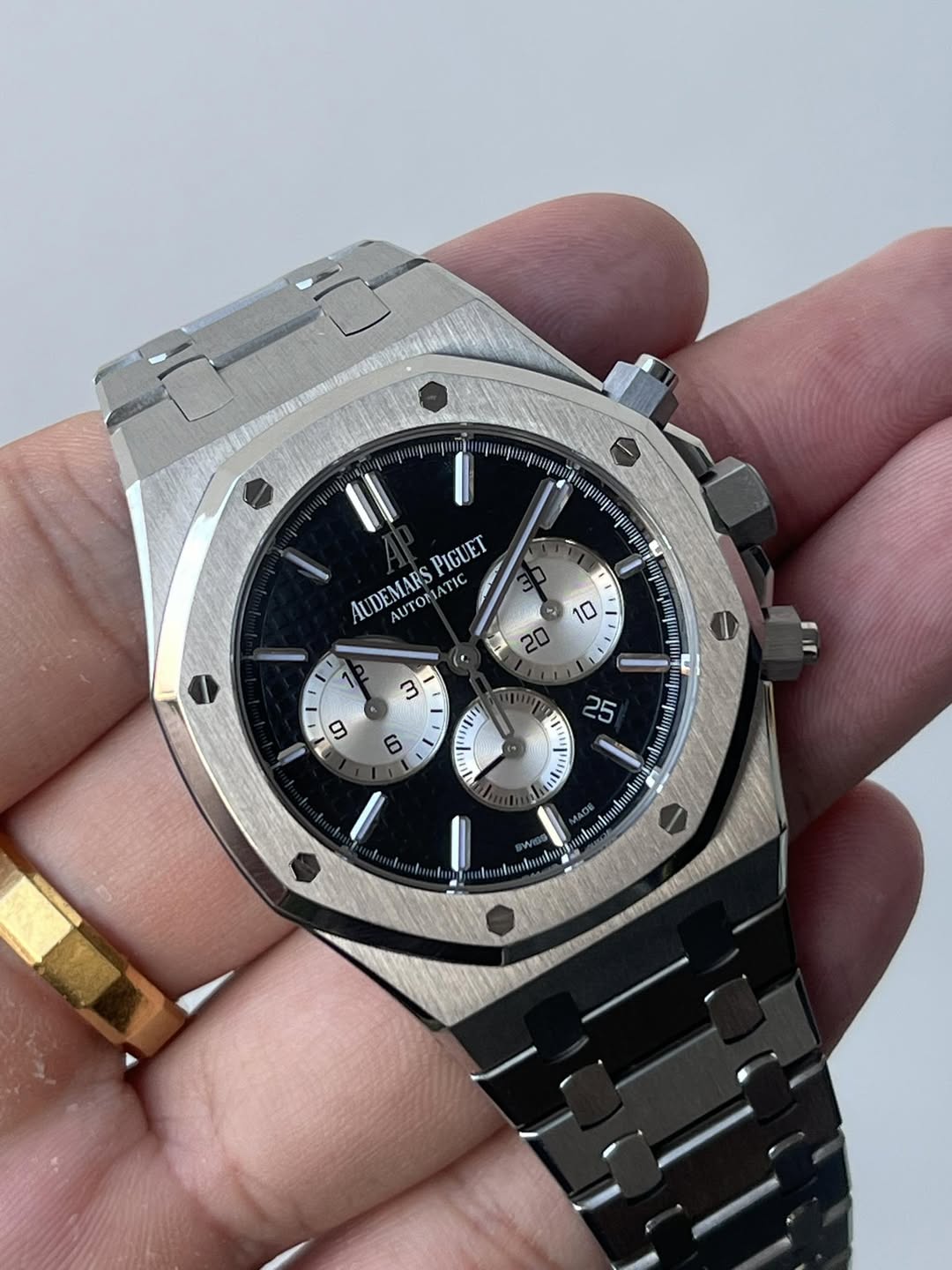 May be an image of wrist watch and text