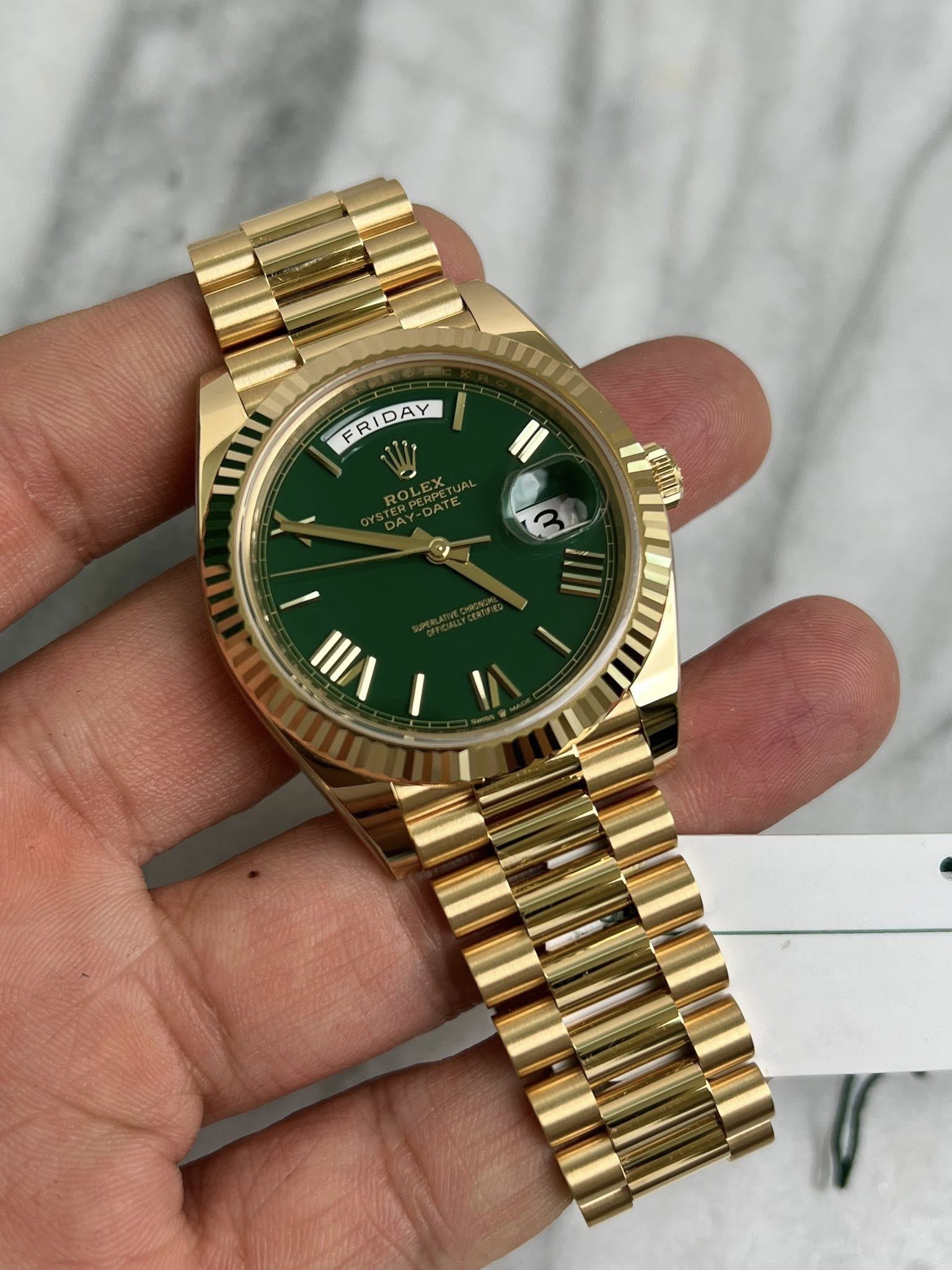 May be an image of wrist watch and text that says 'FRIDAY FRIDAY ๓ I IL -'
