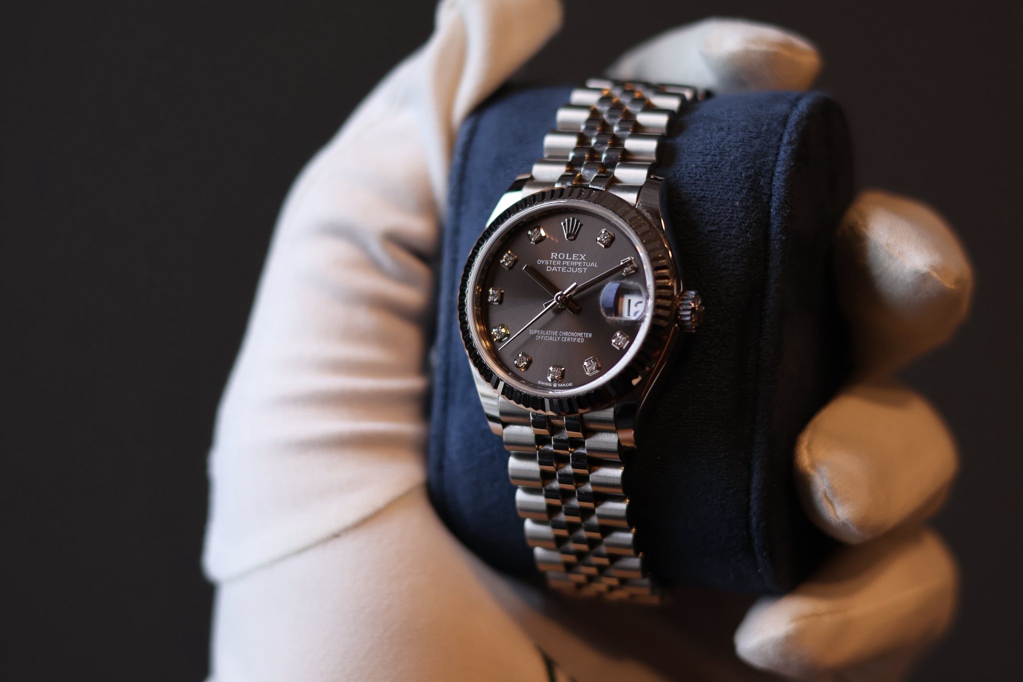 May be an image of wrist watch and text