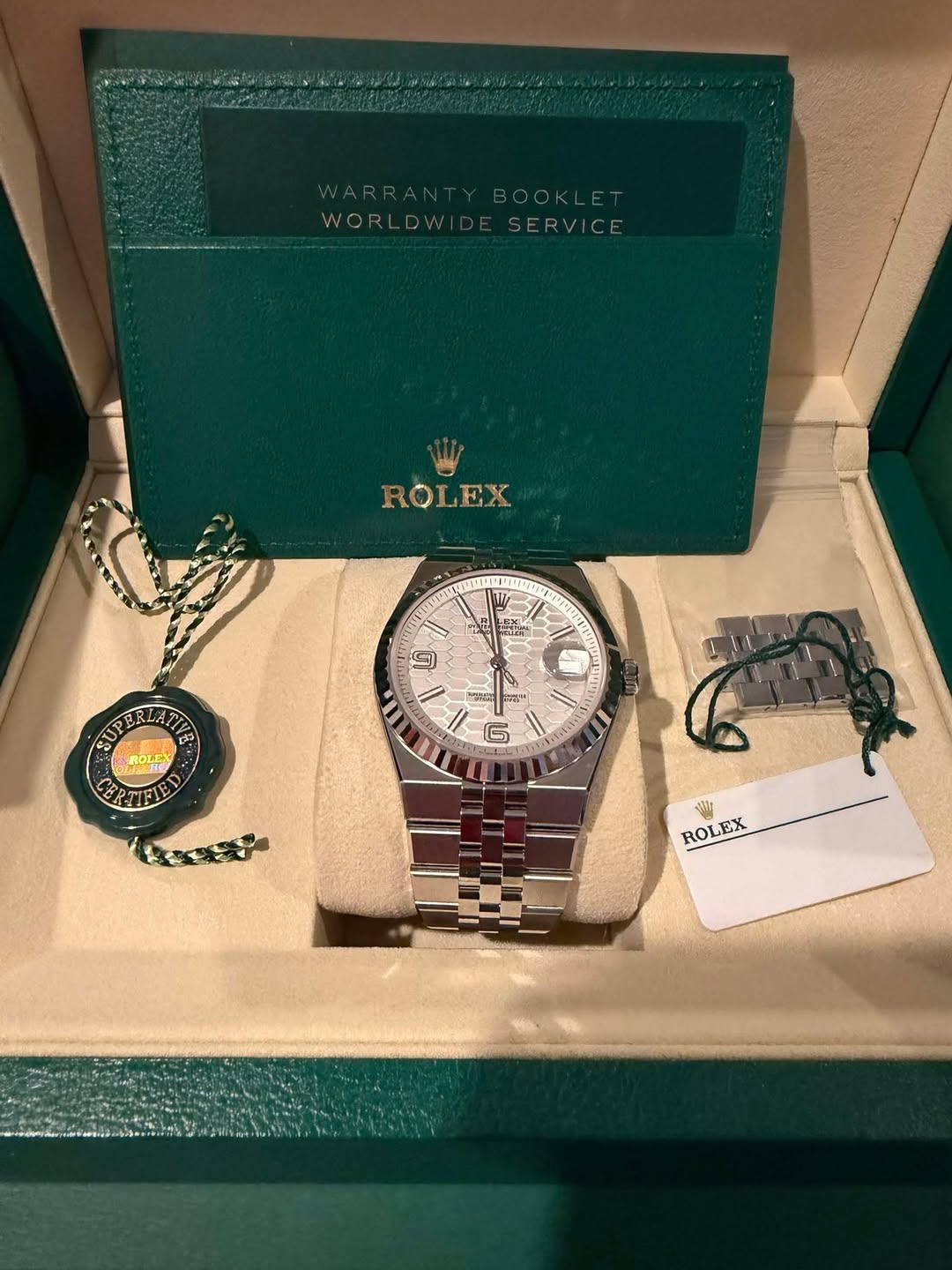 May be an image of wrist watch and text
