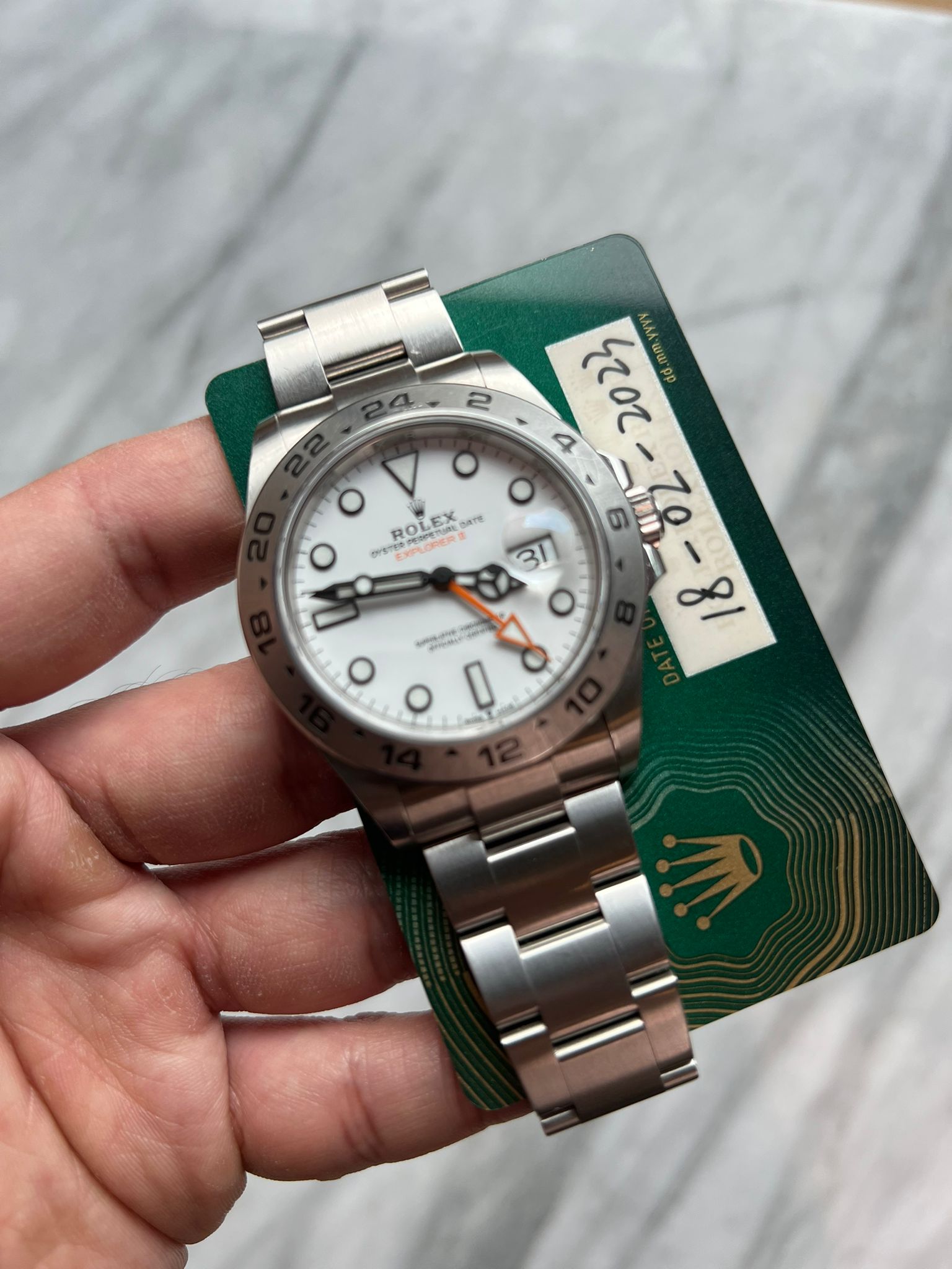 May be an image of wrist watch and text