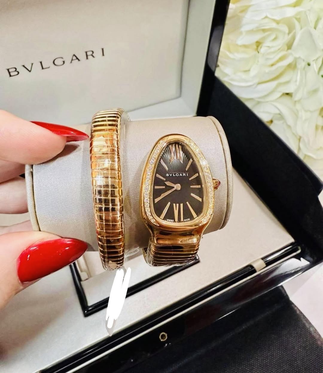 May be an image of wrist watch and text