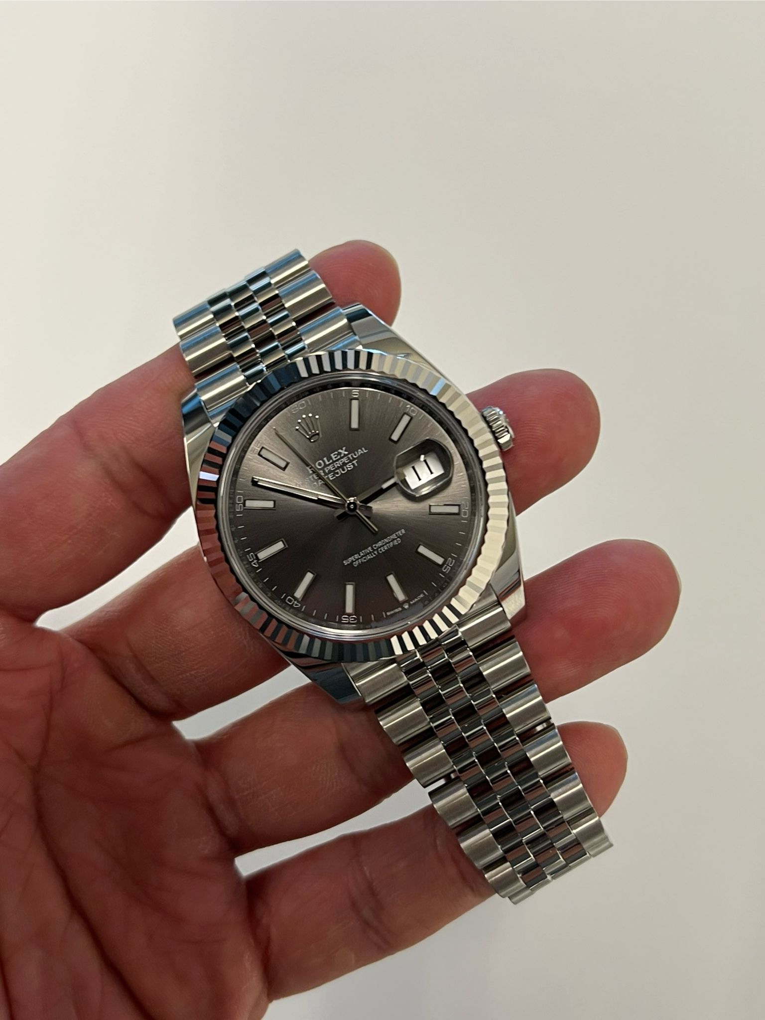 May be an image of wrist watch and text