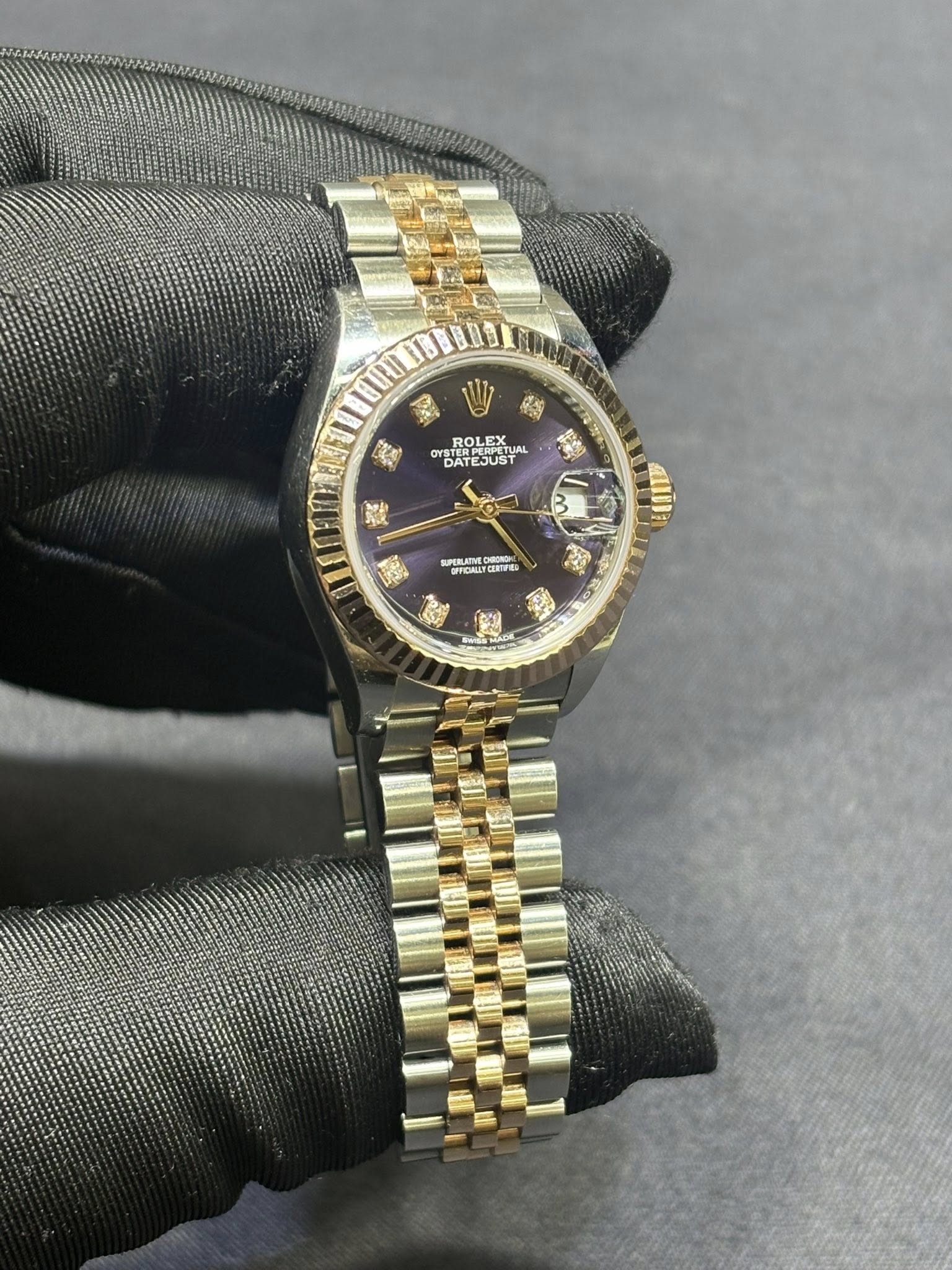 May be an image of wrist watch and text