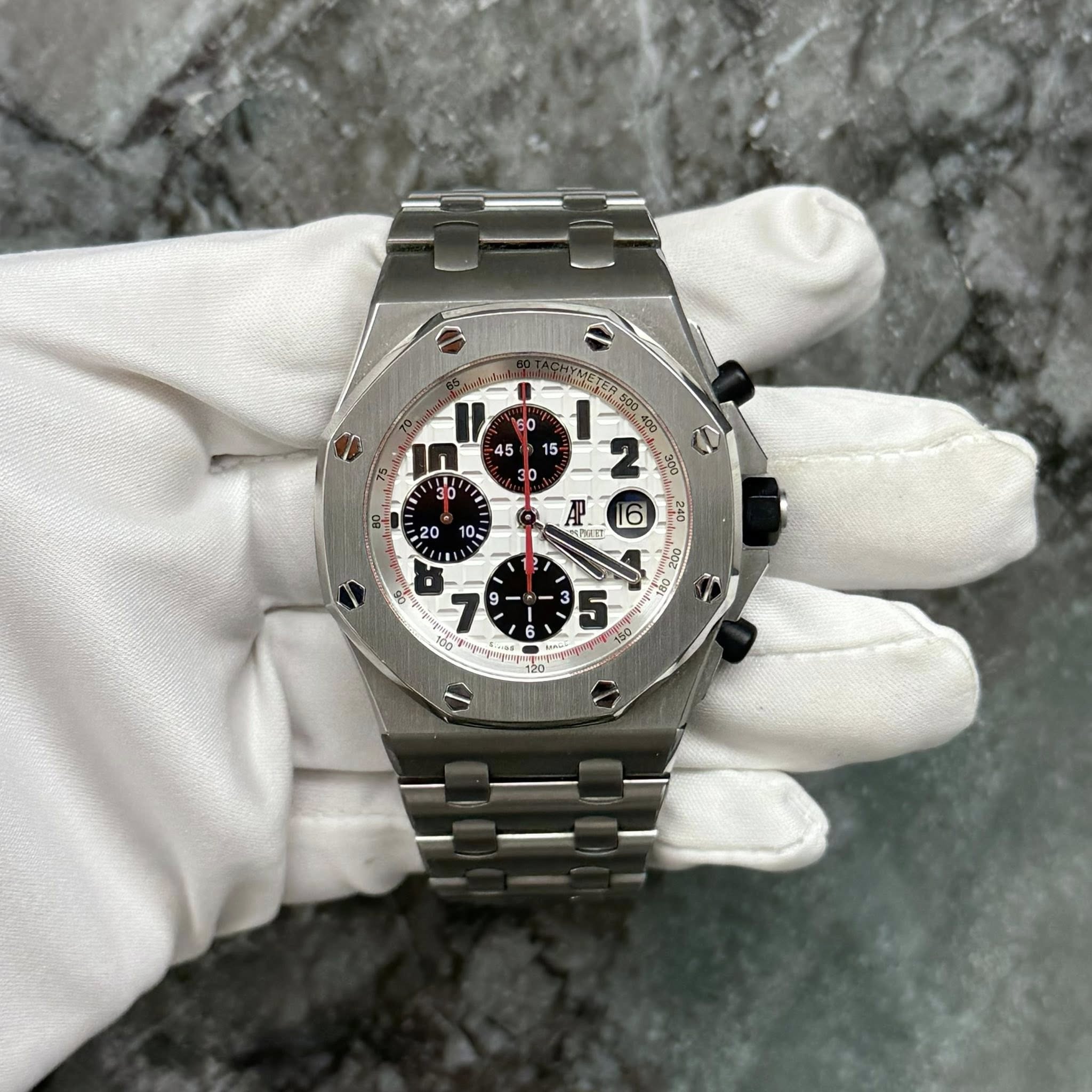 May be an image of wrist watch and text