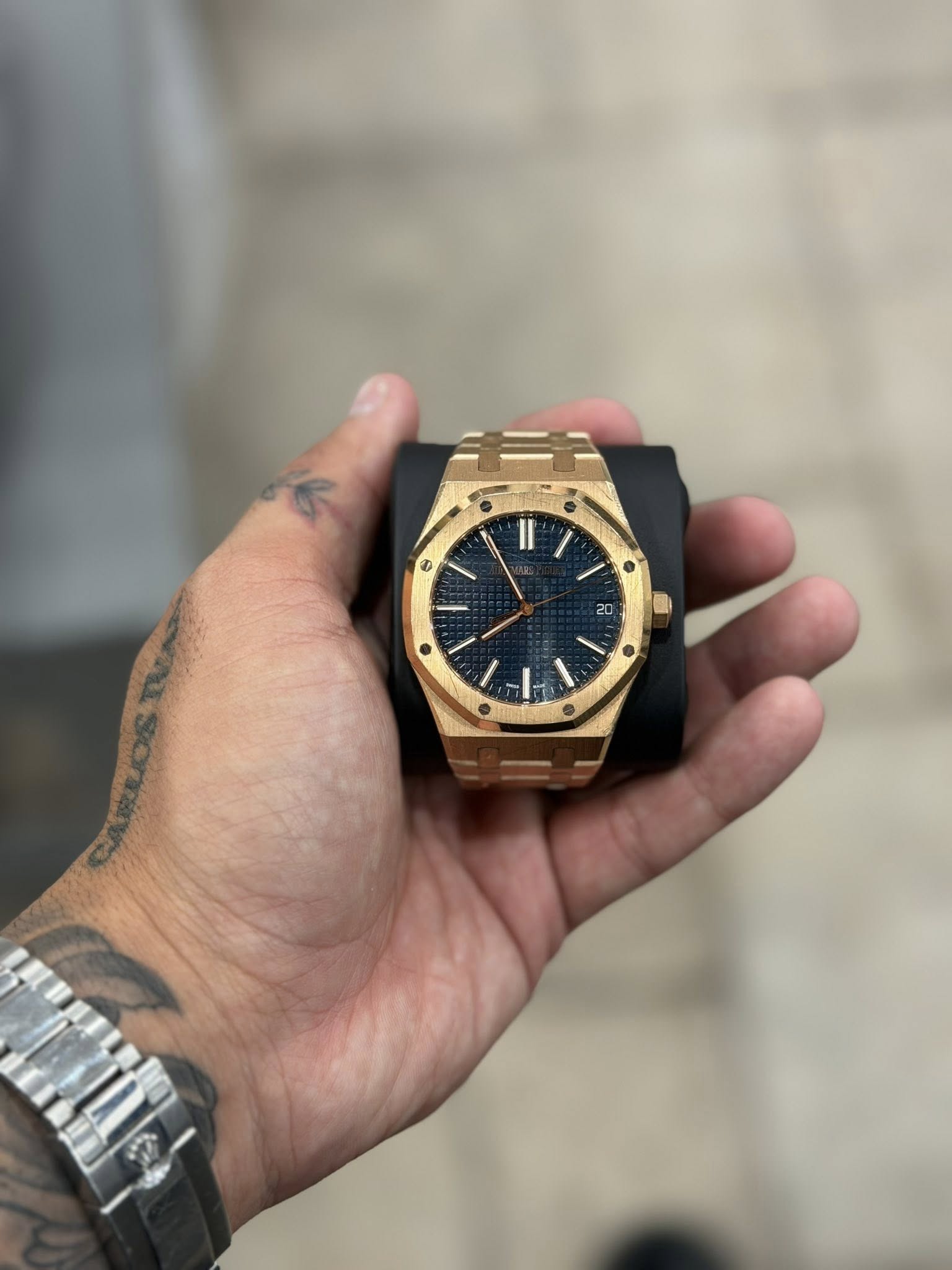 May be an image of wrist watch and text