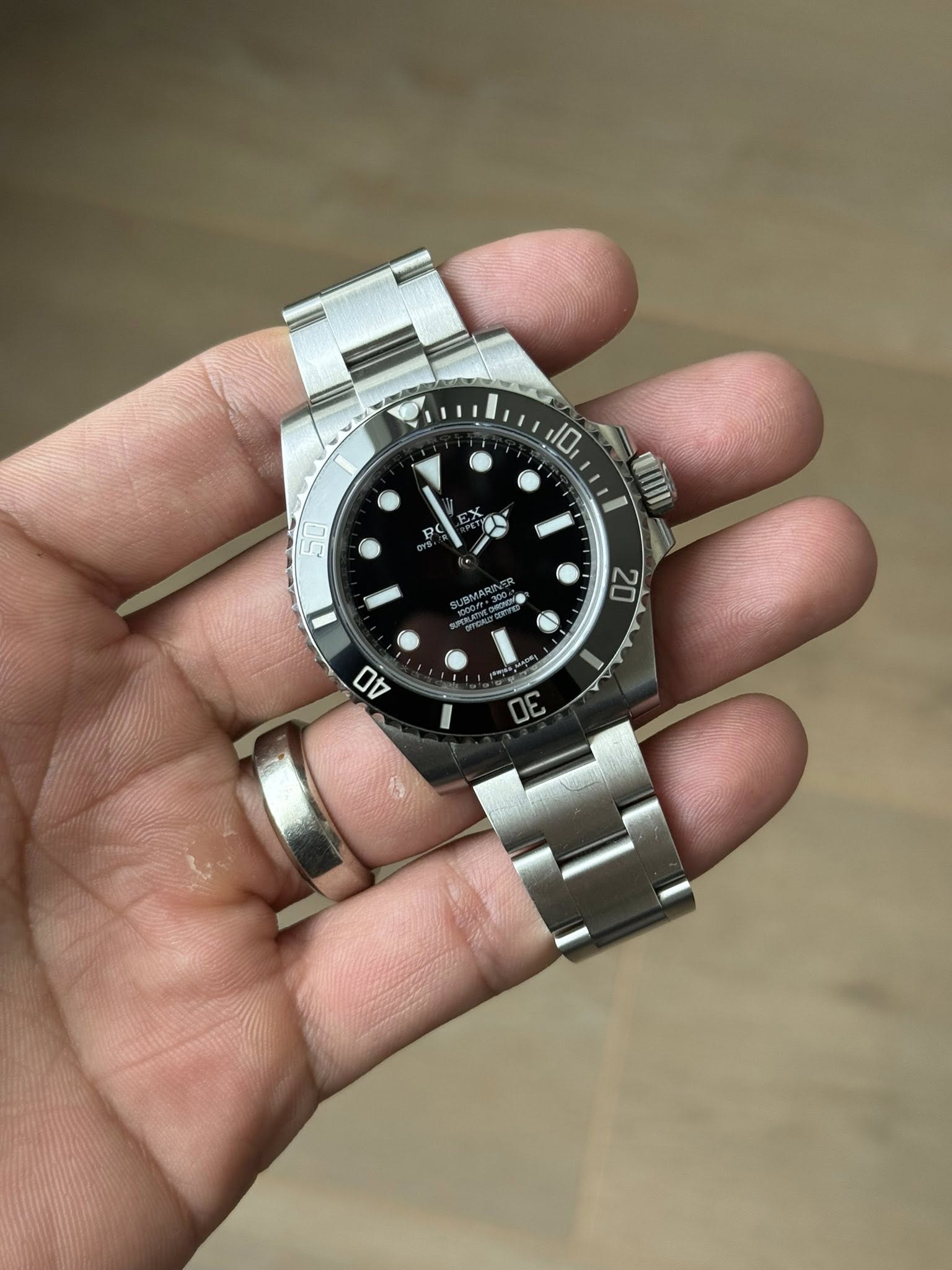 May be an image of wrist watch and text that says '10 2 50 I '