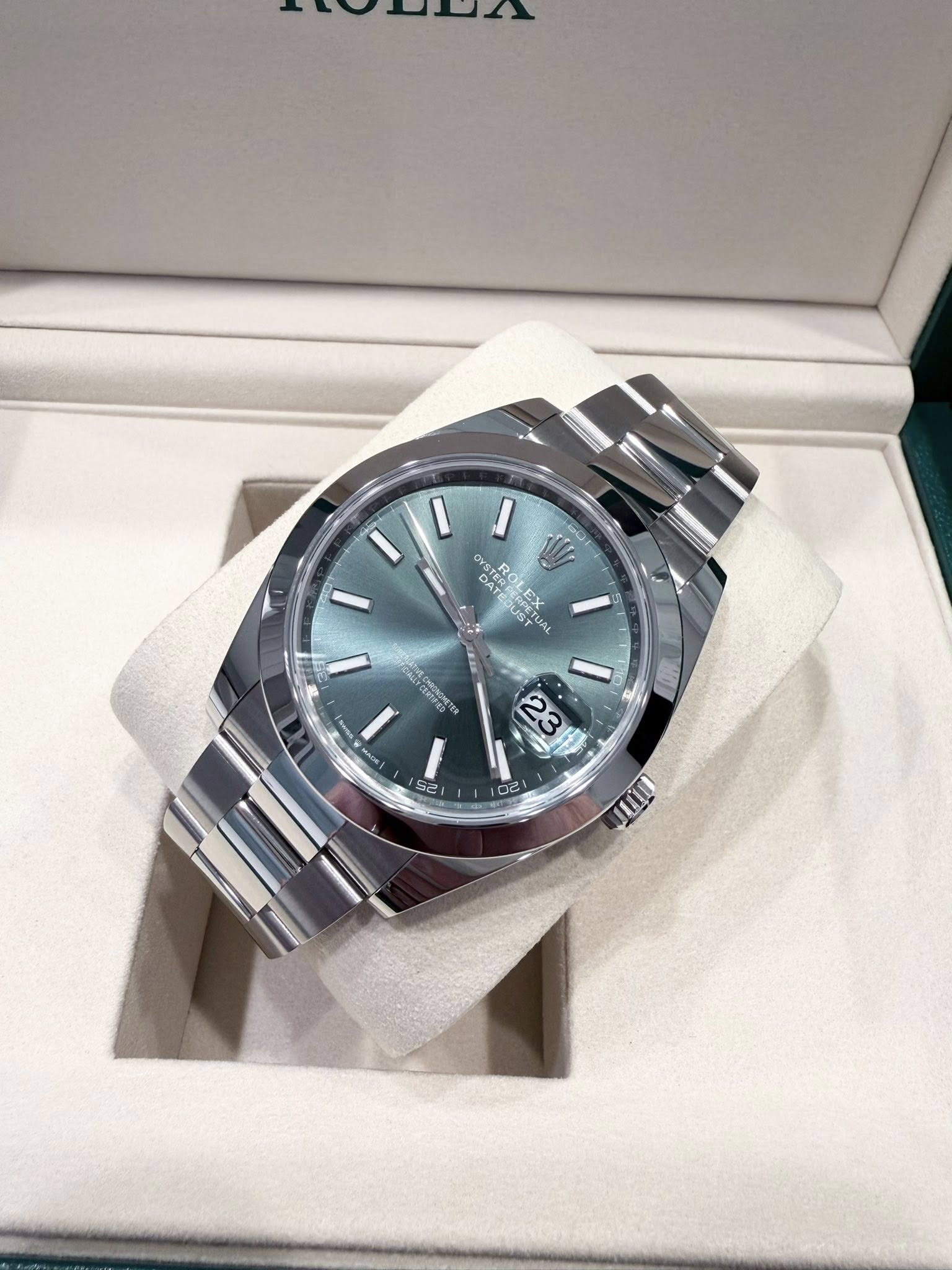 May be an image of wrist watch and text
