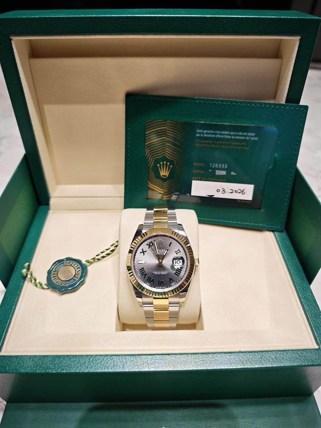 May be an image of wrist watch and text