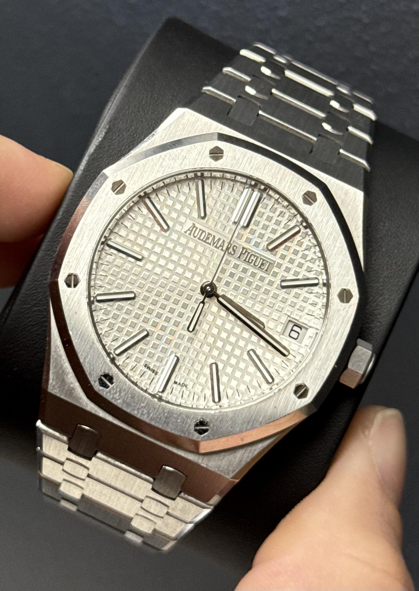 May be an image of wrist watch and text