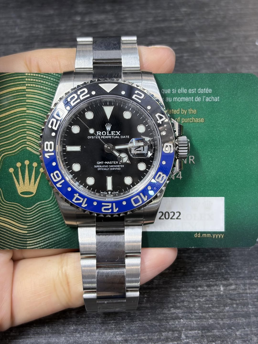 May be an image of wrist watch and text