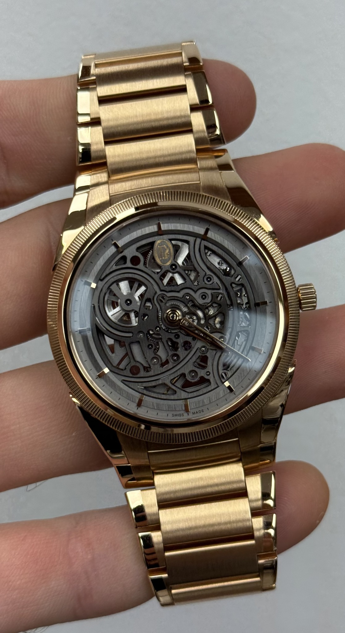 May be an image of wrist watch and text