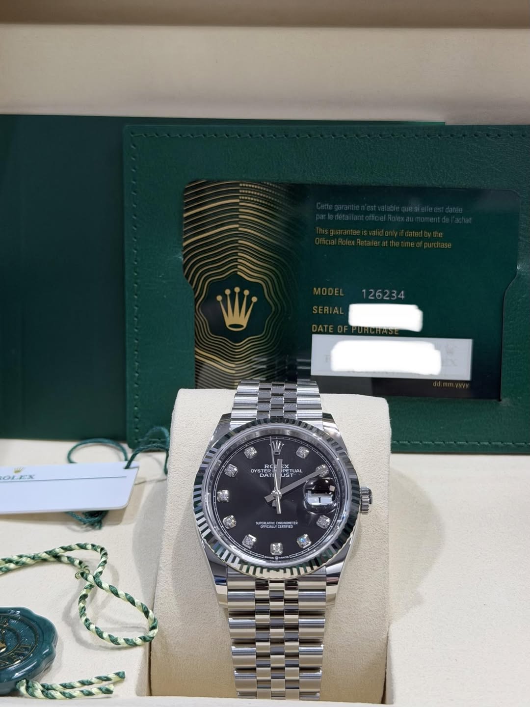 May be an image of wrist watch and text