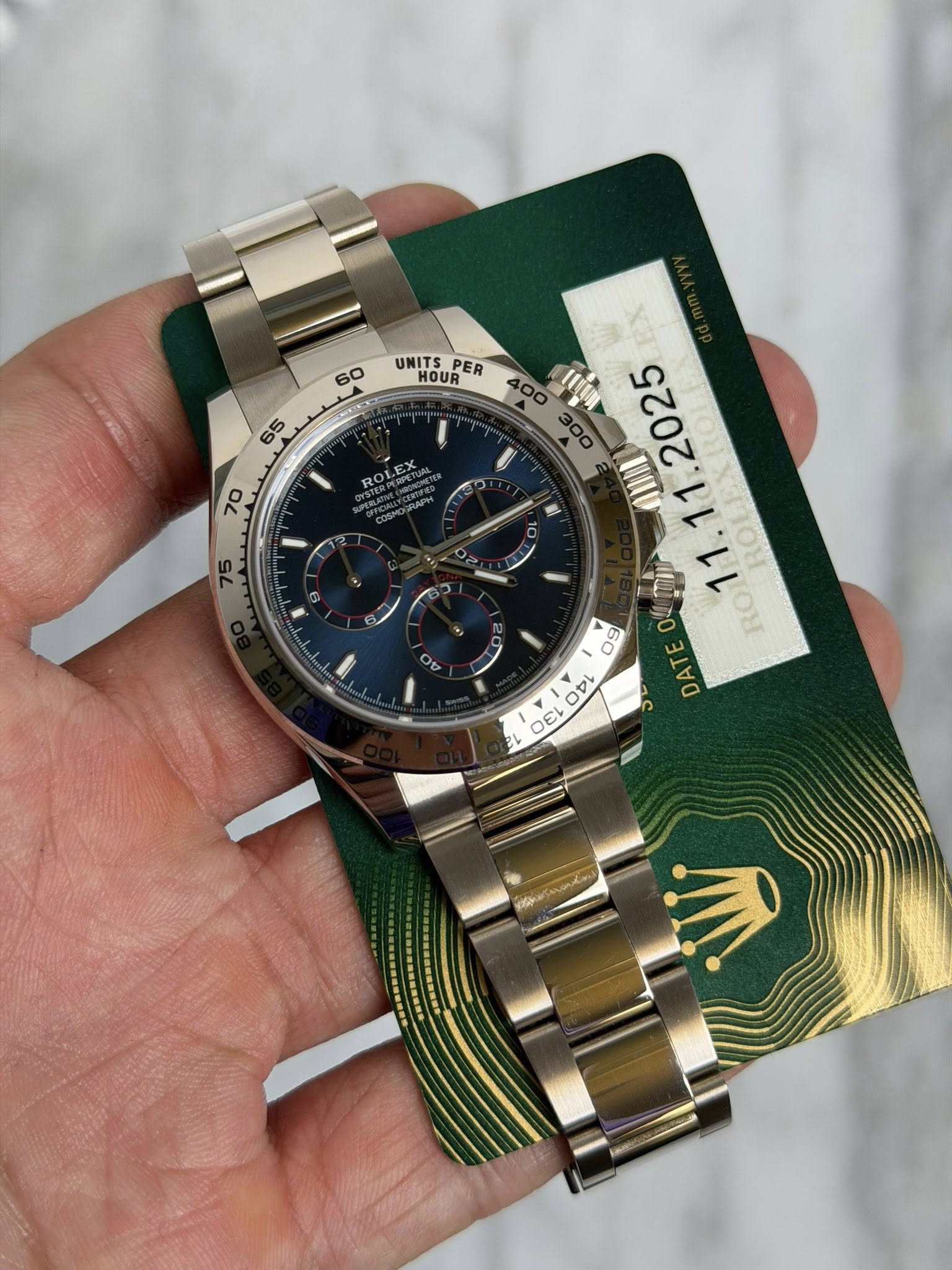 May be an image of wrist watch and text that says '60 65 I 70 ١ 75 BX UNITS HOUR PER 400 IIO TII Θε RO DATE E Ot OFI 21 EL 100 DE'