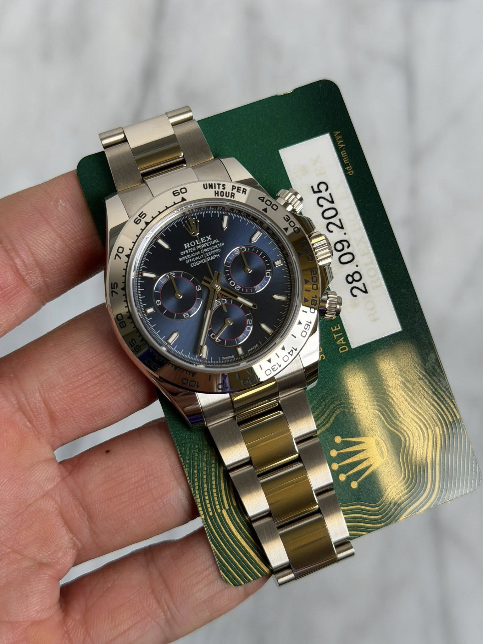 May be an image of wrist watch and text that says '60 65 70 UNITS HOUR PER WAN .09 o 50 9 mNor D श OEL DA'