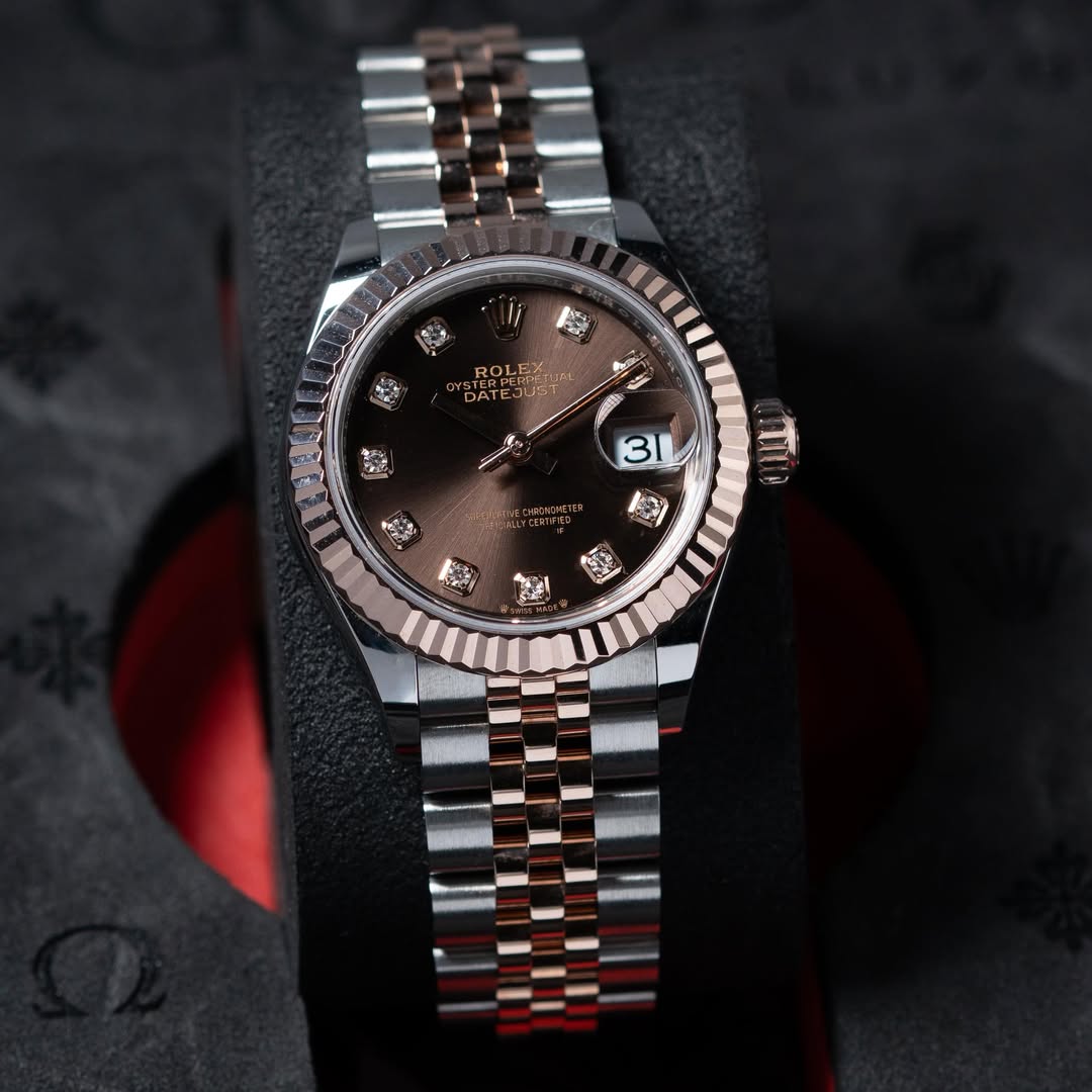 May be an image of wrist watch and text