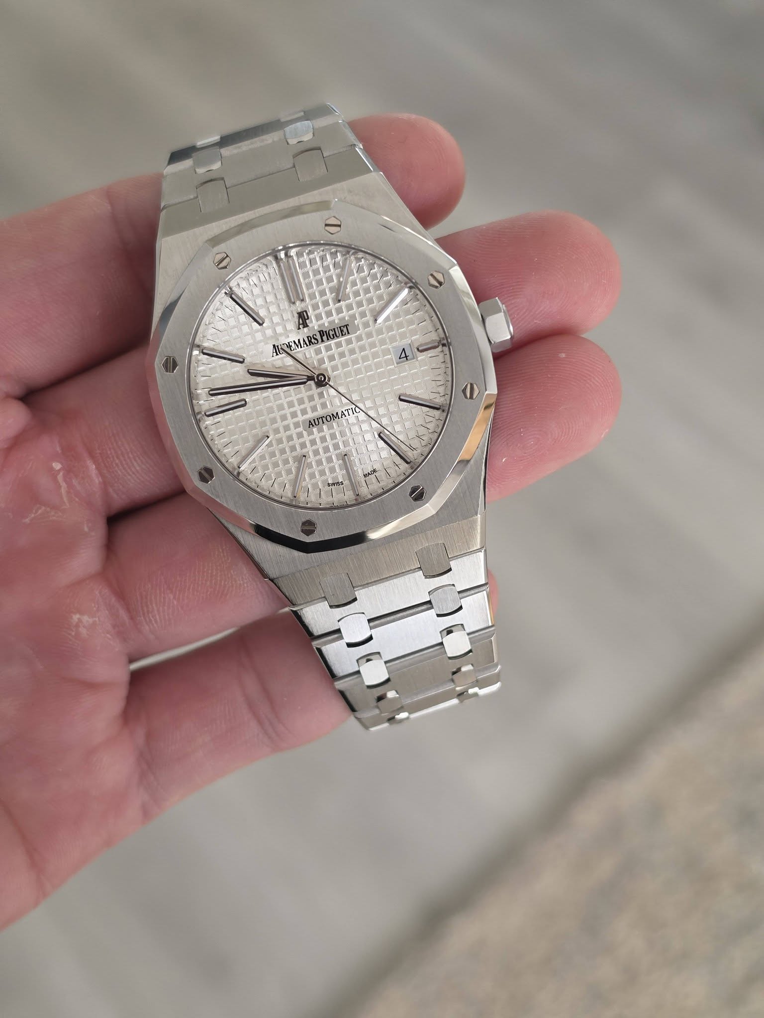 May be an image of wrist watch and text